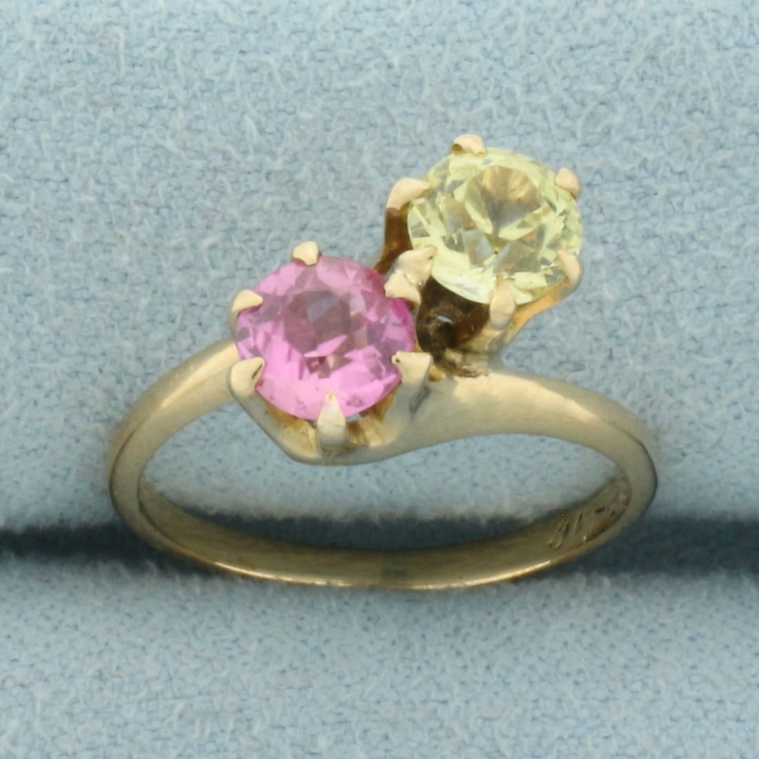 Antique Yellow and Pink Sapphire Toi et Moi Ring in 14k Yellow Gold: In 14k Yellow Gold. Contains two 1/2ct high quality natural Sapphire gemstones, one pink one yellow, with intense color and excellent clarity. Hand engraved inside "J.M.T. 12-25-16" from 1916. Size 5.