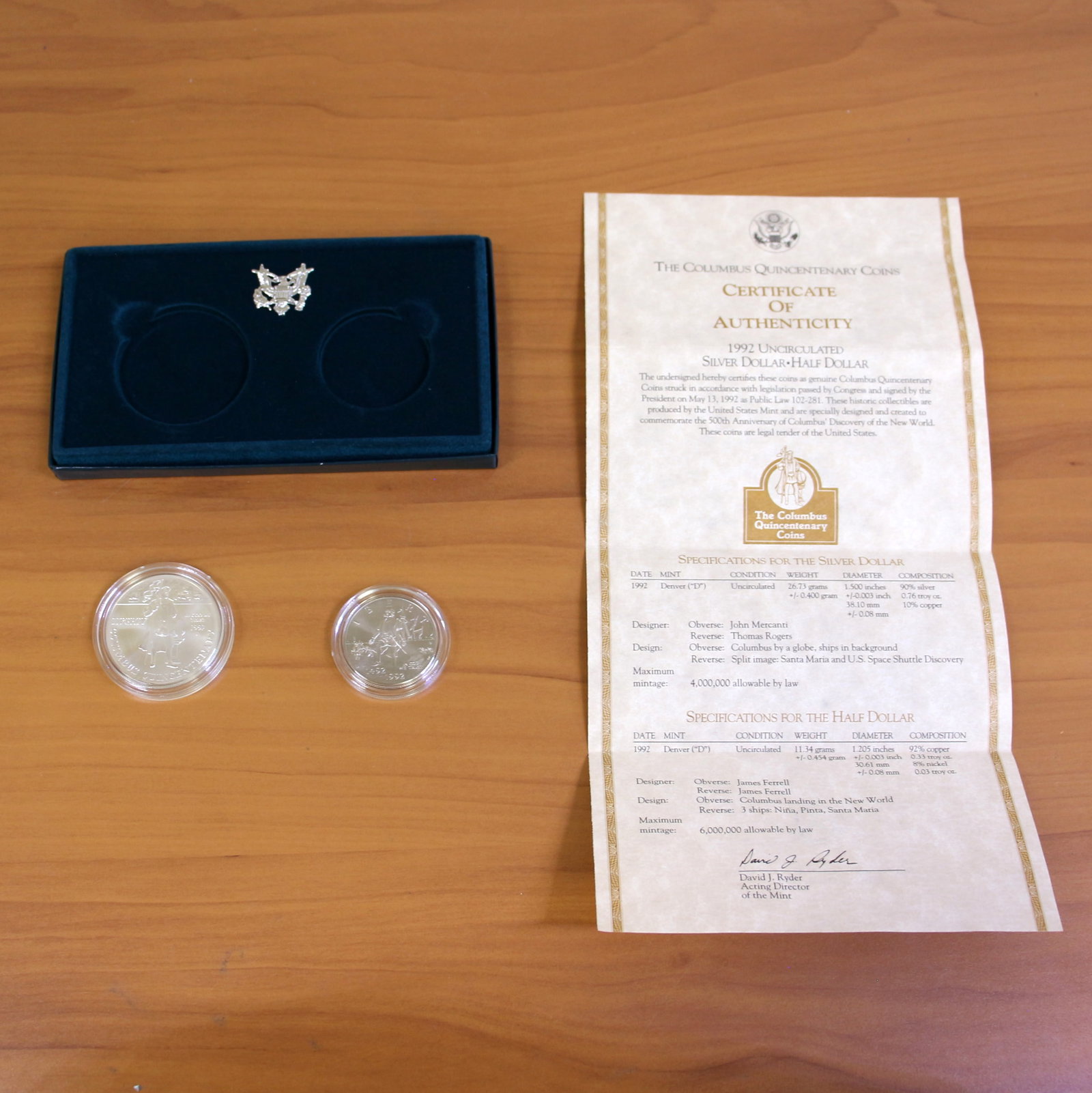 US Mint Columbus Quincentenary Coin Set OGP: Contains one 1992 90% Silver Denver Mint Columbus Quincentenary Silver Dollar and 1992 Denver Mint Columbus Quincentenary Half Dollar. Set in original government packaging and contains certificate of 