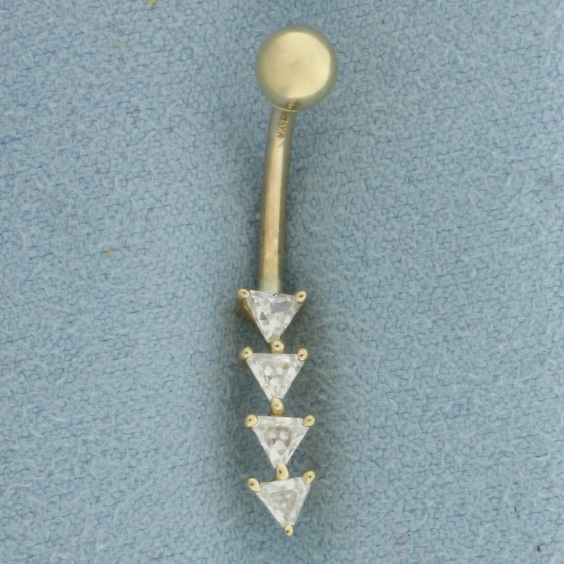 CZ Belly Ring in 14k Yellow Gold: In 14k Yellow Gold. Contains four 4mm high quality trillion cut Cubic Zirconia gemstones with excellent cut and clarity. 1.0g.
