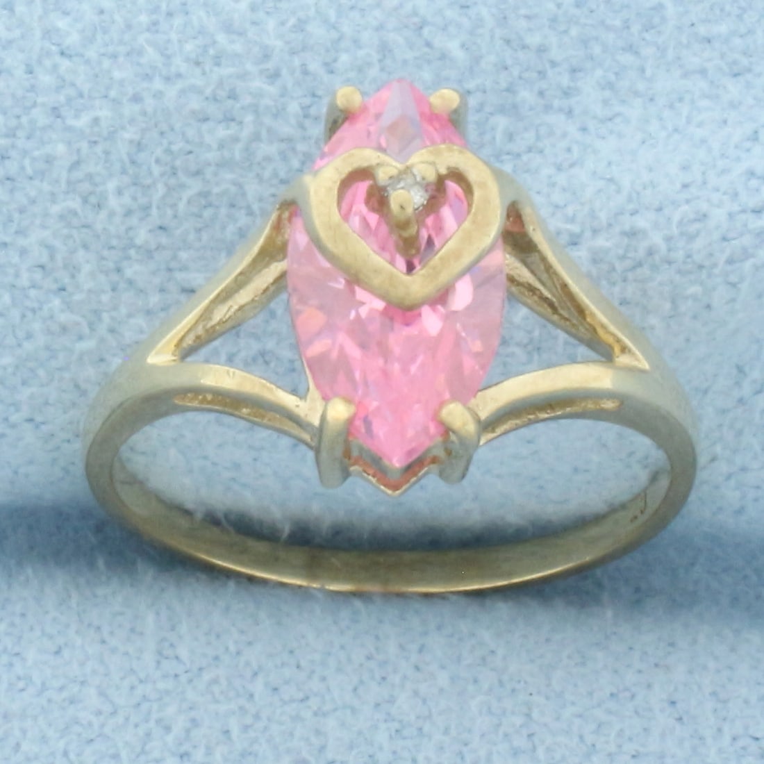 Morganite Heart Ring in 10k Yellow Gold: In 10k yellow gold. Contains one high quality 12mm by 6mm marquise Morganite gemstone, approximately 2cts, with intense pink salmon color and excellent clarity. Also contains one high quality 1/2pt di