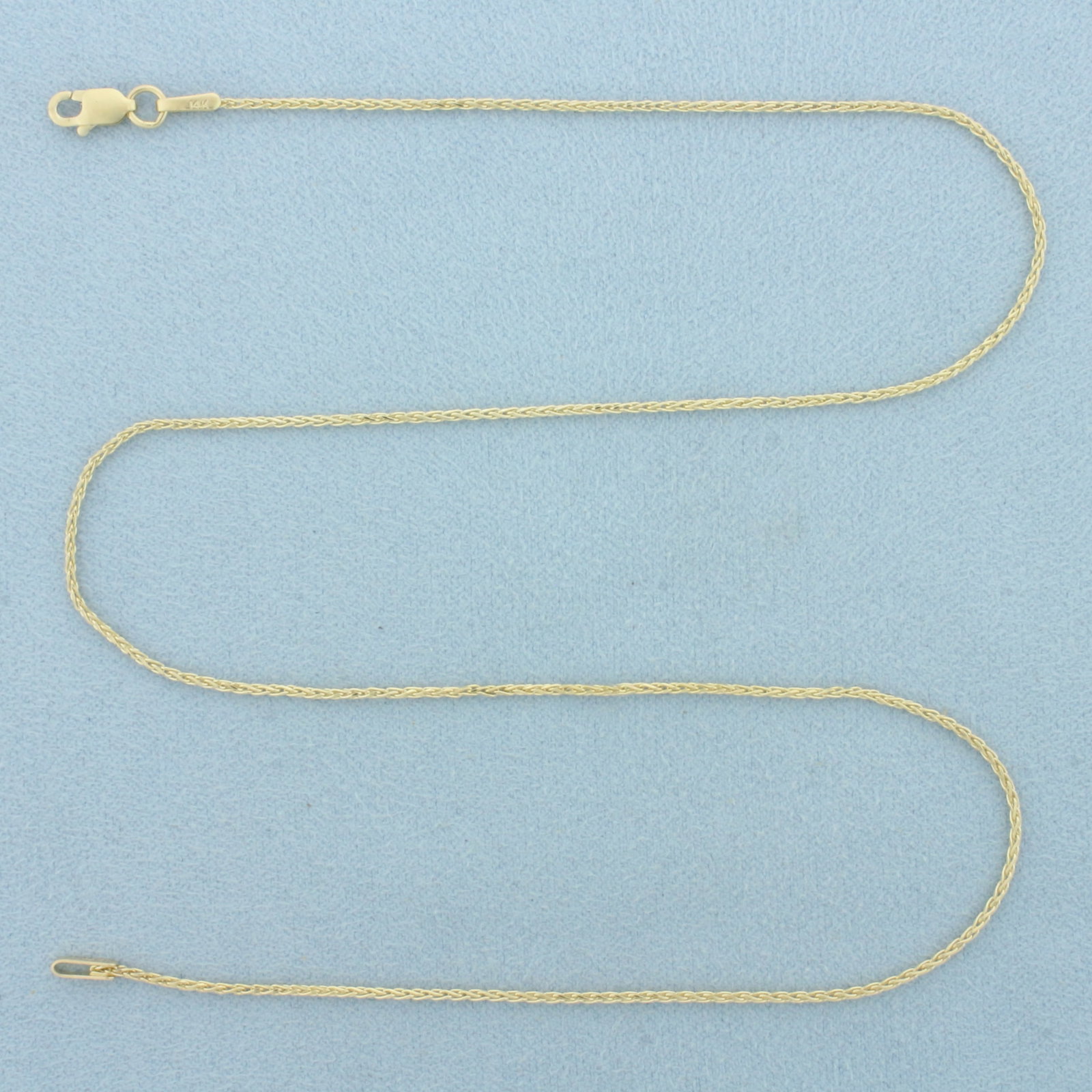 16 Inch Wheat Link Choker Necklace in 14k Yellow Gold: In 14k Yellow Gold. 16 inches long. 1.1mm wide. Lobster clasp. 2.5g.