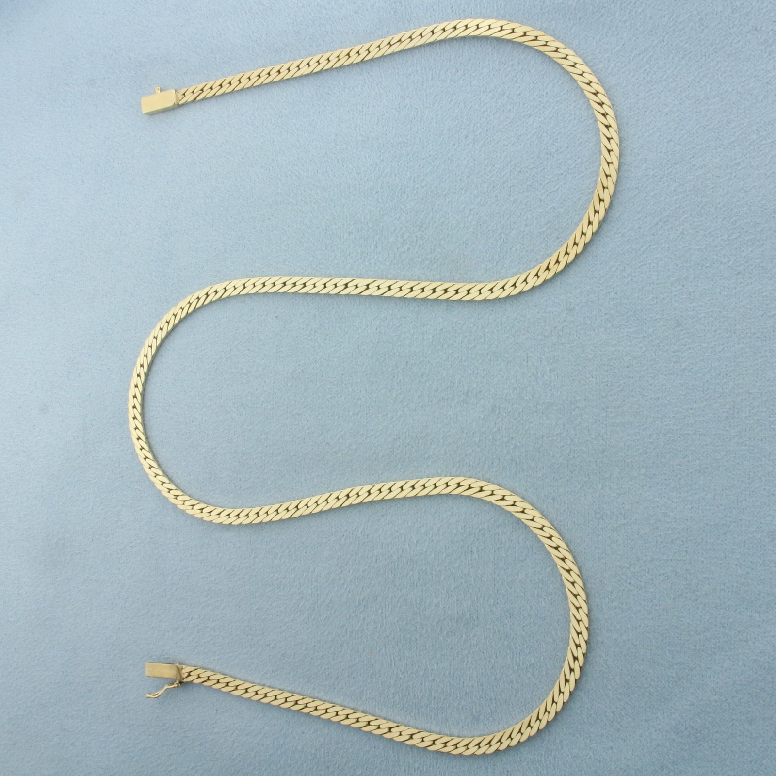 18 Inch Herringbone Link Chain Necklace in 14k Yellow Gold: In 14k Yellow Gold. 18 inches long. 3.1mm wide. Slide clasp with safety latch. 15.1g.
