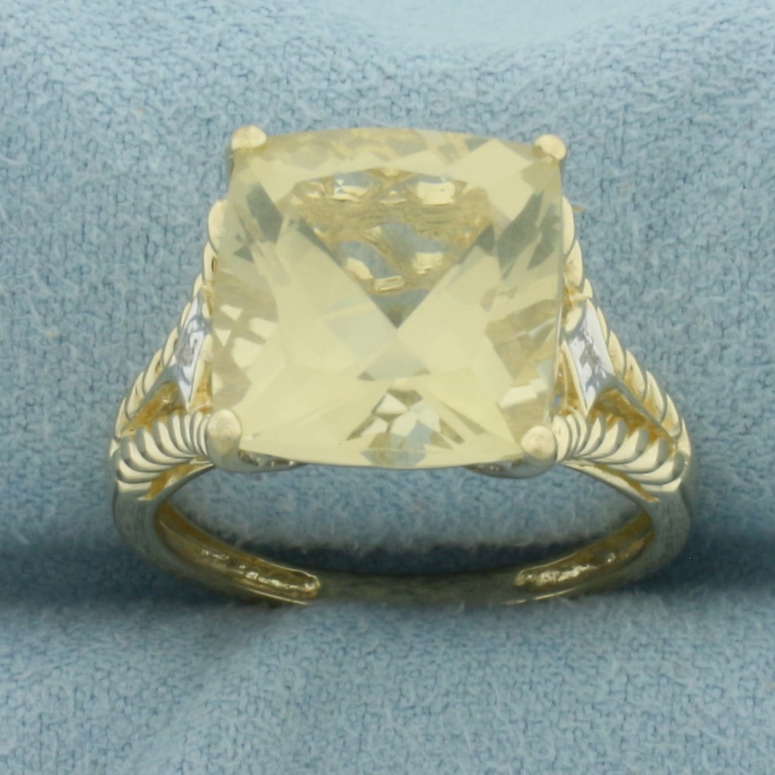 Yellow Tourmaline and Diamond Statement Ring in 14k Yellow Gold: In 14K Yellow Gold. Contains one high quality 12mm checkerboard cushion cut Citrine gemstone, approximately 8ct, with bright color and excellent clarity. Also contains 2 high quality .01ct diamonds. S