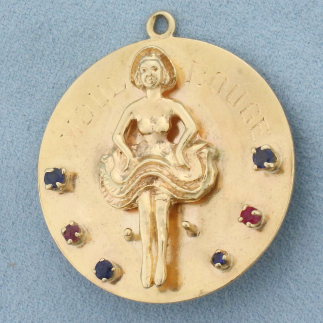 Large French Moulin Rouge Cancan Dancer Pendant in 14k Yellow Gold: In 14k yellow gold. 1.5 inch diameter on disc. Contains five Sapphire and three Ruby high quality gemstones, 1/2ct TW, with vibrant color. 21.5g.