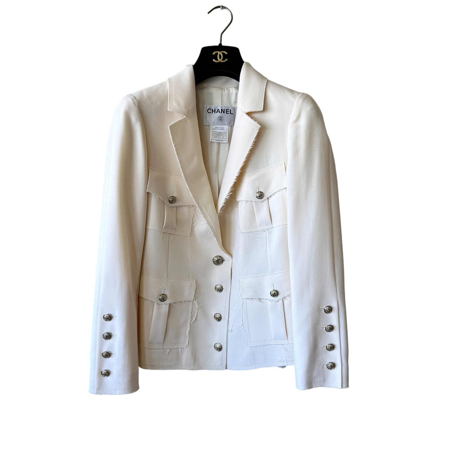 Chanel 07P Runway #1 Look Raw Edge Military Style Blazer Jacket 38: This was the #1 look for the Chanel Spring 2007 Ready-to-wear runway. 07P, P30968V20717, AQ598, size 38. Ivory wool blend with raw edge detail. Fully lined with 100% silk. Iconic CC logo tweed pattern