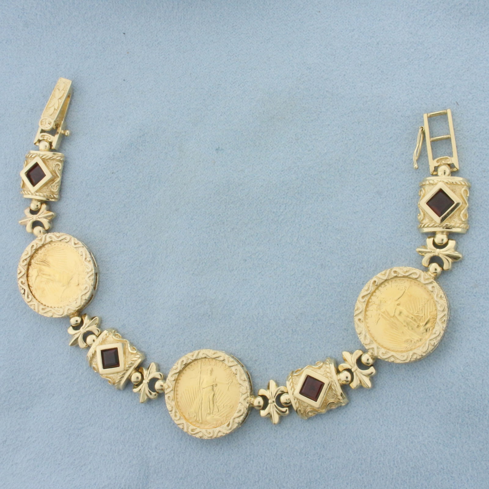 Gold Eagle Bullion Coin and Garnet Bracelet in 14k Yellow Gold: In 14k Yellow Gold Mounting. Contains three high quality 1/10 oz Gold Eagle $5 coins. Also contains four high quality natural 5mm Garnet gemstones with intense color and excellent clarity. Adjustable 