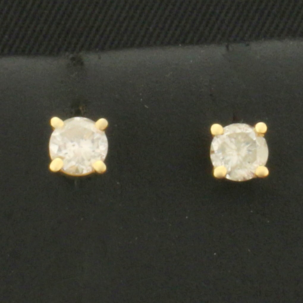 Diamond Stud Protektor Back Earrings in 14k Yellow Gold: In 14k Yellow Gold. Contains two high quality round brilliant diamonds, 1/3ct TW,H color/I clarity, eye clean, great cut for added brilliance. Protektor squeeze release backs for added security. 1.0g.