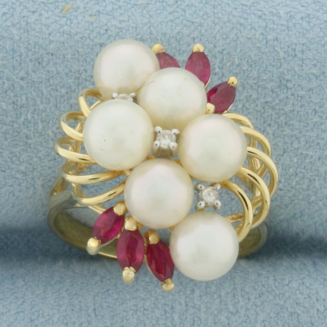 Ruby, Pearl, and Diamond Ring in 14k Yellow Gold: In 14k yellow gold. 21mm wide at top of ring. Contains six high quality natural 4mm marquise Ruby gemstones with intense color and excellent clarity. Also contains 6 high quality 5.6mm Cultured Akoya 