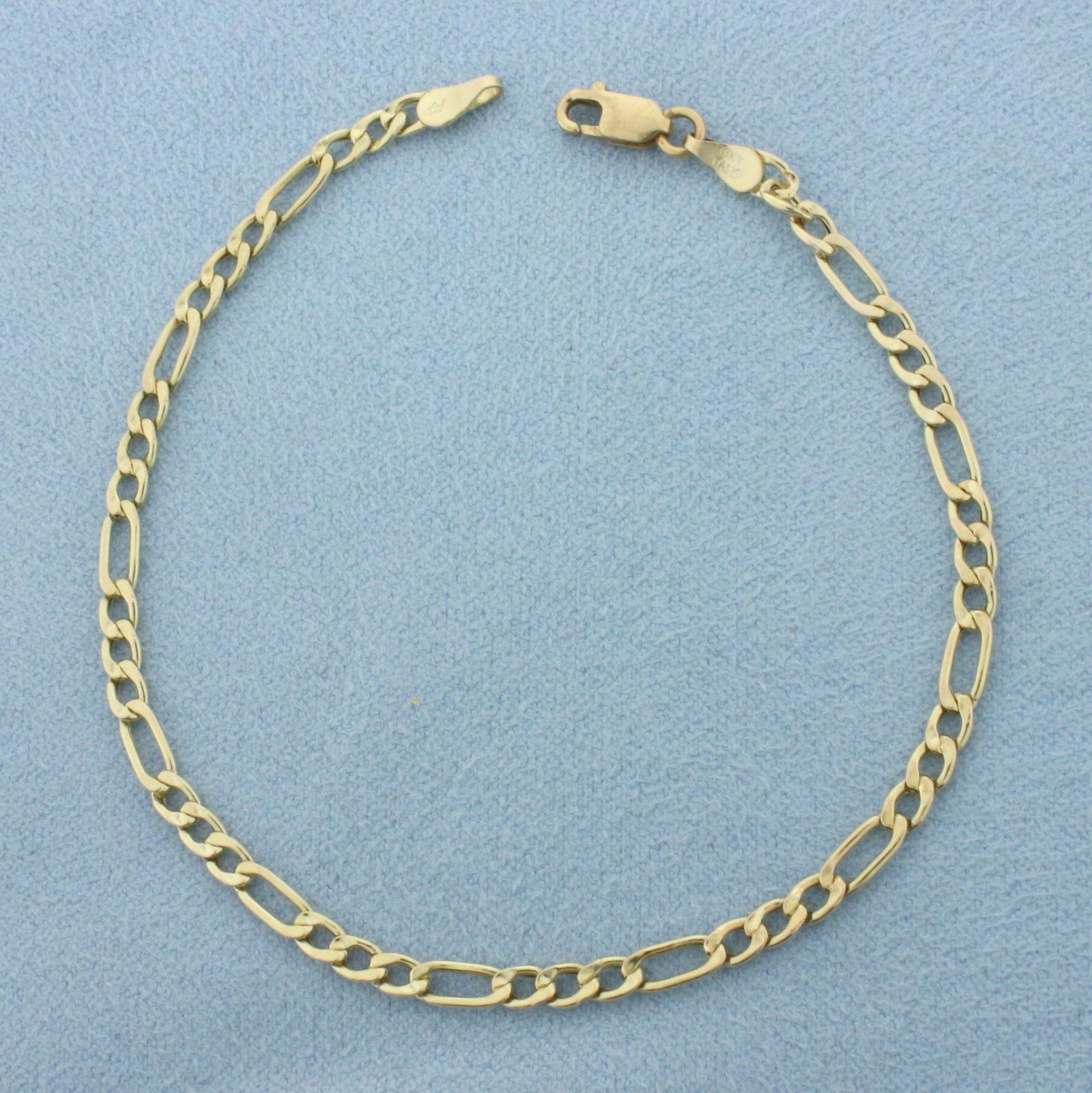 Italian Figaro Link Bracelet in 10k Yellow Gold: In 10k Yellow Gold. 7 1/4 inches long. 3mm wide. Italian made. Lobster clasp. 1.2g.