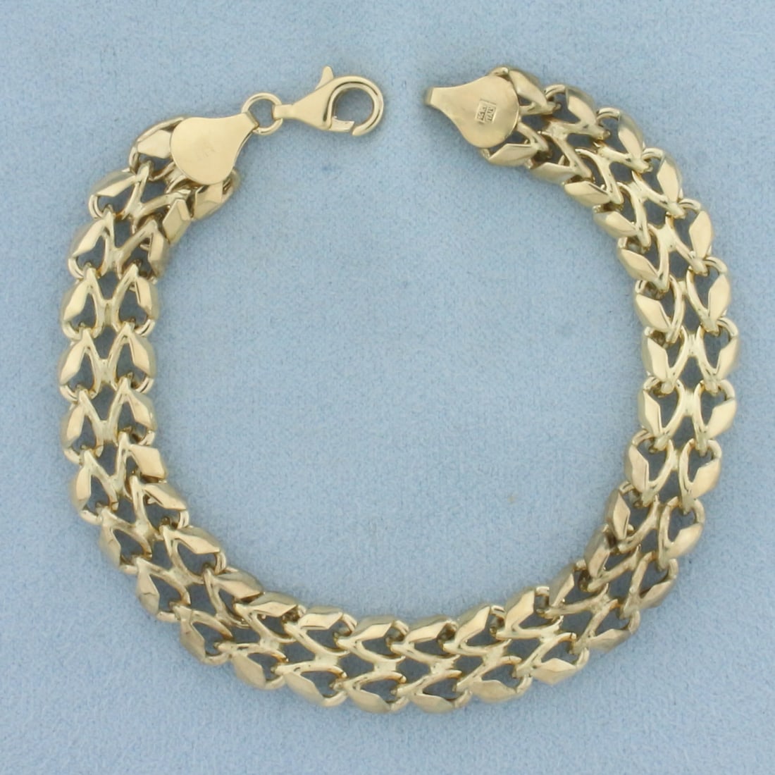 Italian Woven Link Bracelet in 14k Yellow Gold: In 14k Yellow Gold. 7 1/4 inches long. 3/8 inch wide. Italian made. Lobster clasp. 8.6g.