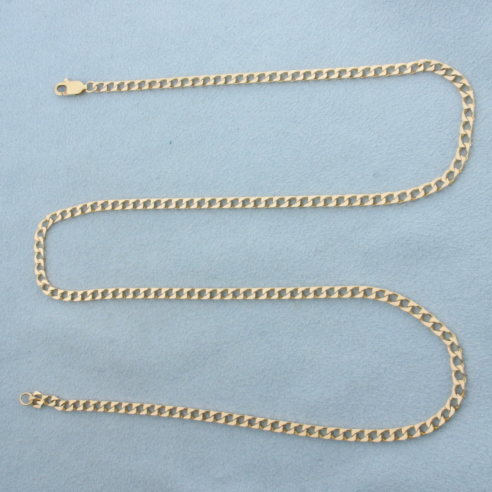 21 Inch Curb Link Chain Necklace in 14k Yellow Gold: In 14k Yellow Gold. 21 inches long. 2.7mm wide. Lobster clasp. 9.3g.