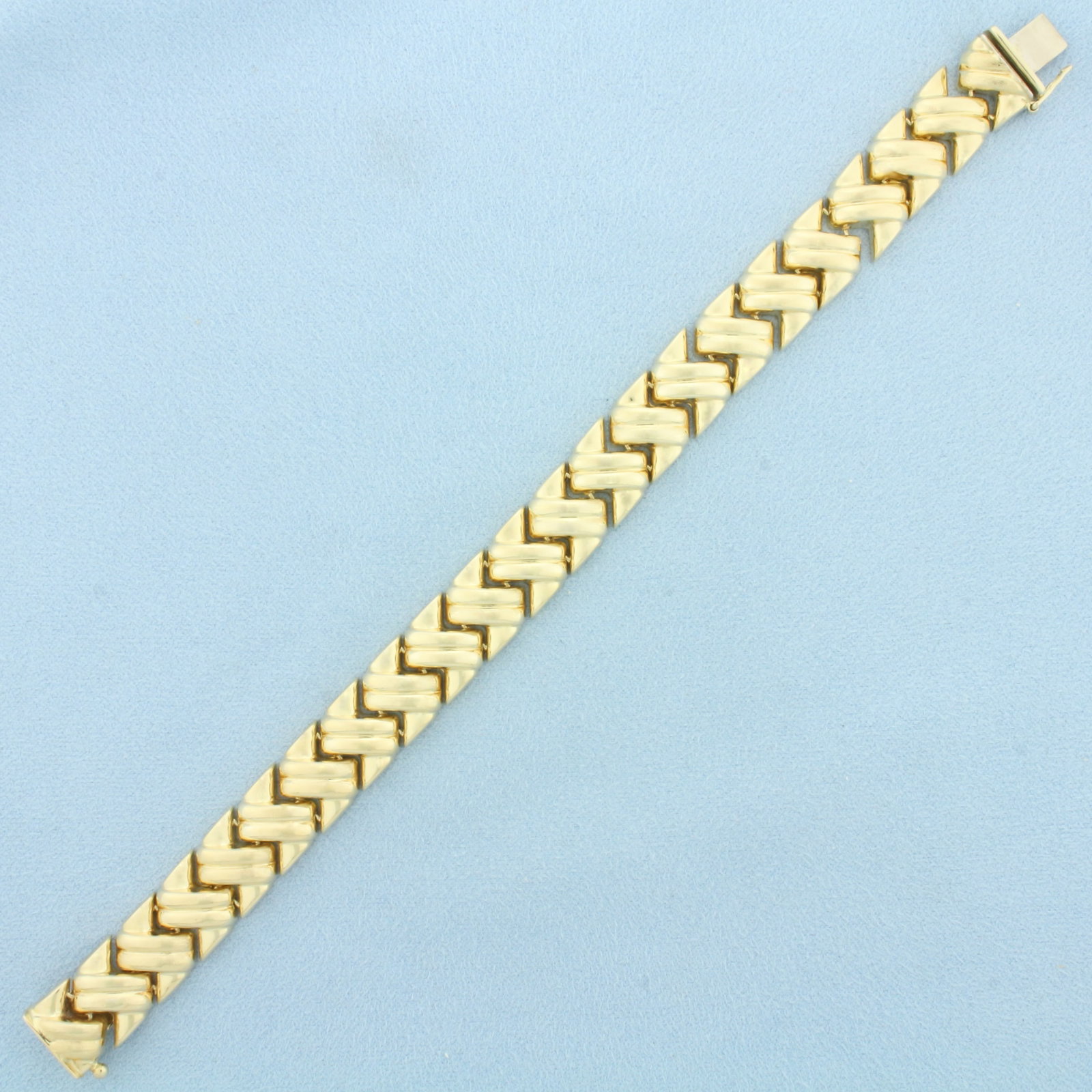 Puffy S Link Bracelet in 14k Yellow Gold: In 14k Yellow Gold. 7 1/2 inches long. 12mm wide. Concealed slide clasp with safety latch. 23.7g.