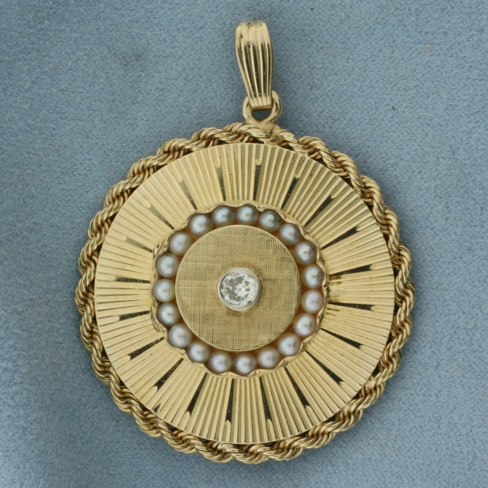 Large Vintage Diamond and Pearl Locket Pendant in 14K Yellow Gold: In 14k yellow gold. Center locket opens. Measures 2 inches long by 1.5 inches wide. Contains one high quality 1/4ct diamond, H color/I clarity. Accented with 19 high quality 3mm cultured pearls. 20.6g