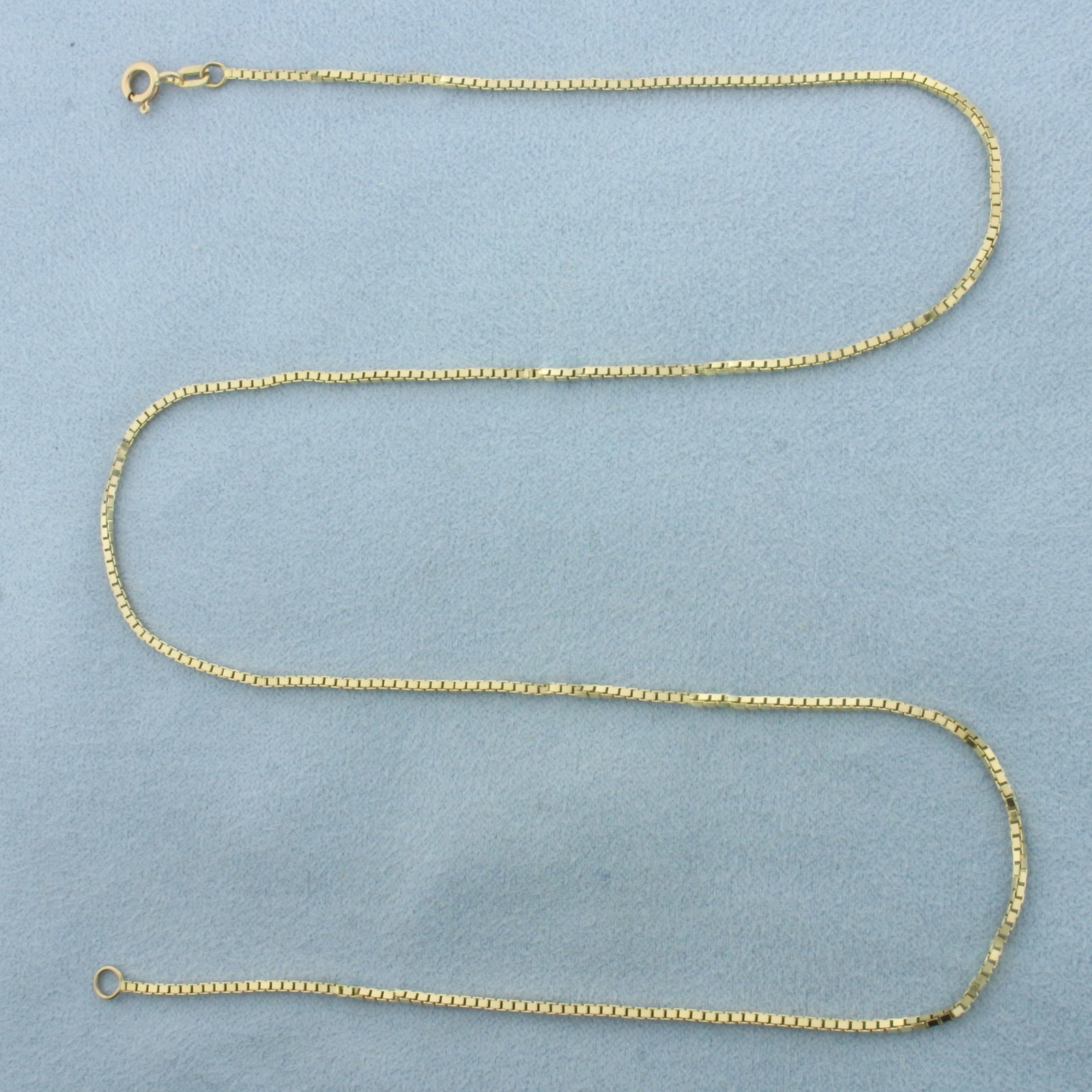 18 Inch Box Link Chain Necklace in 14k Yellow Gold: In 14k Yellow Gold. 18 inches long. 1.2mm wide. Spring clasp. 5.0g.