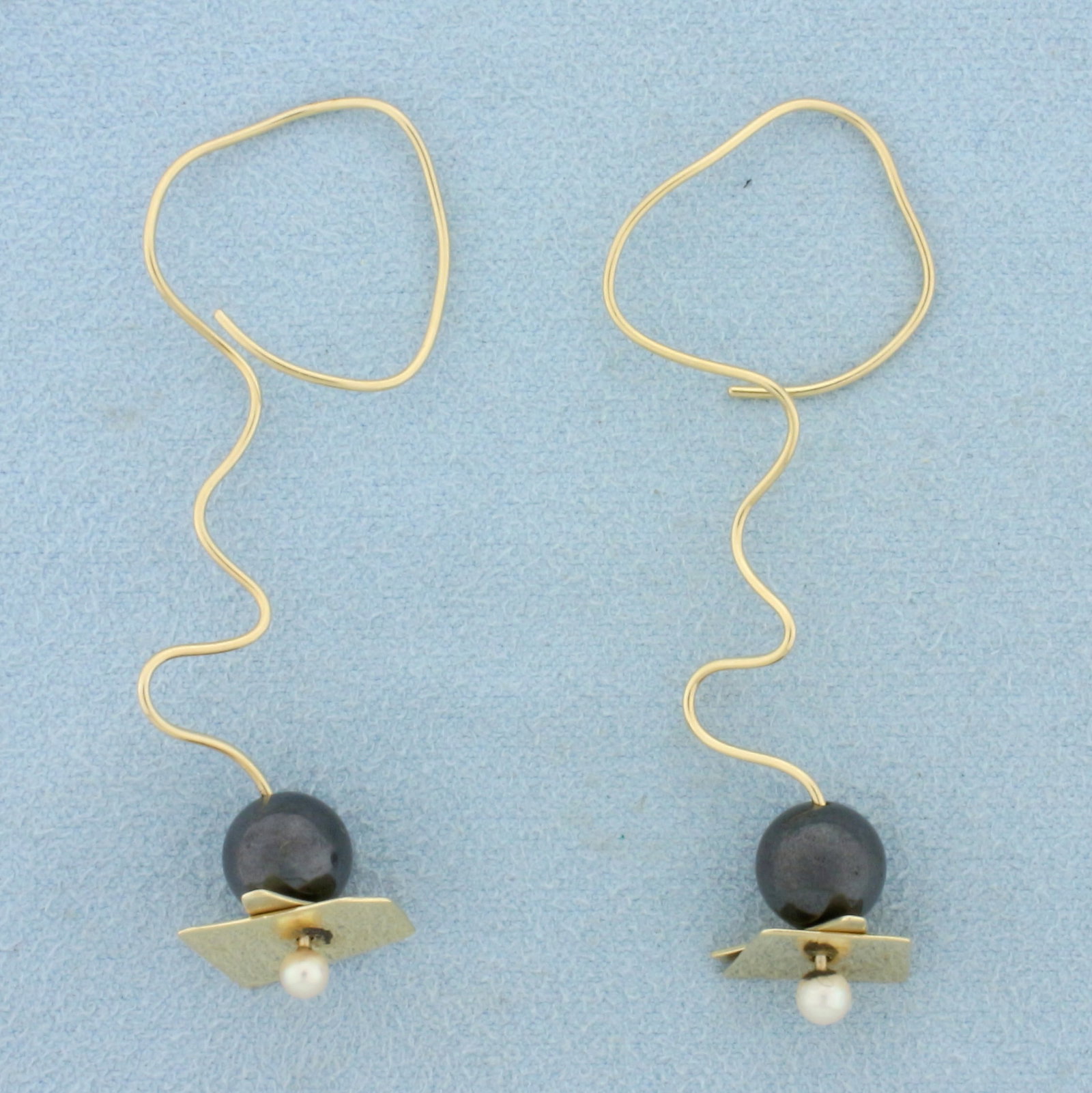 Hand Crafted One of a Kind Pearl Wire Dangle Earrings in 14K Yellow Gold: In 14K Yellow Gold. 2 1/4 inches long. Each earring also contains one high quality natural 8mm Black Pearl. Each earring also contains one high quality natural 3mm cultured freshwater pearl. 5.4g.