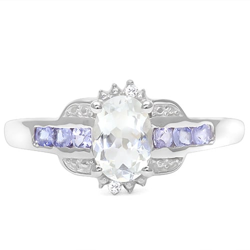 Aquamarine, Tanzanite, and Diamond Ring in Sterling Silver: In platinum over .925 sterling silver. Contains one oval cut aquamarine gemstone, .58cts, and six tanzanite gemstones, .20ctw. Accented with 2 genuine diamonds, .01ctw. Size 7. 1.9g
