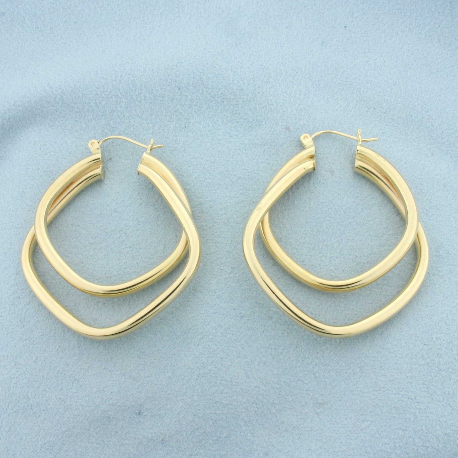 Double Square Tube Hoop Earrings in 14k Yellow Gold: In 14k yellow gold. 1 3/4 inches long by 1 1/2 inches wide. Tubes are 3.2mm diameter. 7.4g.