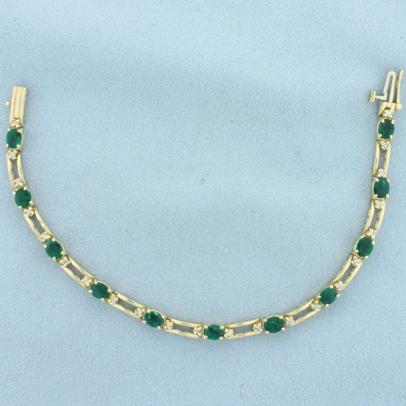 Emerald and Diamond Line Bracelet in 14k Yellow Gold: In 14k Yellow Gold. Contains fourteen natural 4mmx5mm high quality Emerald gemstones, 1/3ct each, with vibrant color. Also contains twenty-two high quality 1/2pt diamonds. 7 inches long by 4.2mm wide.