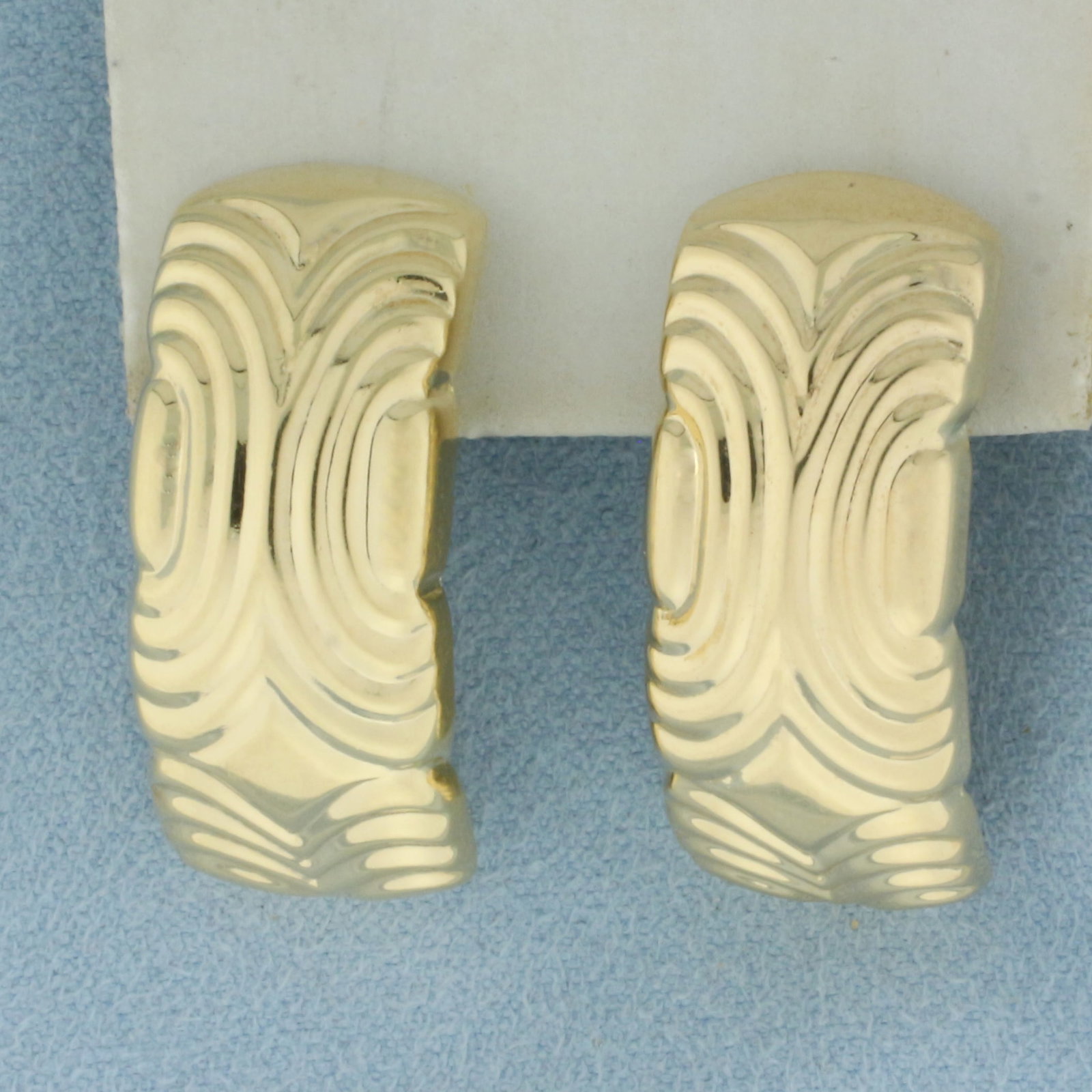 Designer Water Ripple Design J-Hoop Earrings in 14k Yellow Gold: In 14k Yellow Gold. 1 1/8 inch long. 1/2 inch wide. Michael Anthony designer. Friction backs. 4.2g.