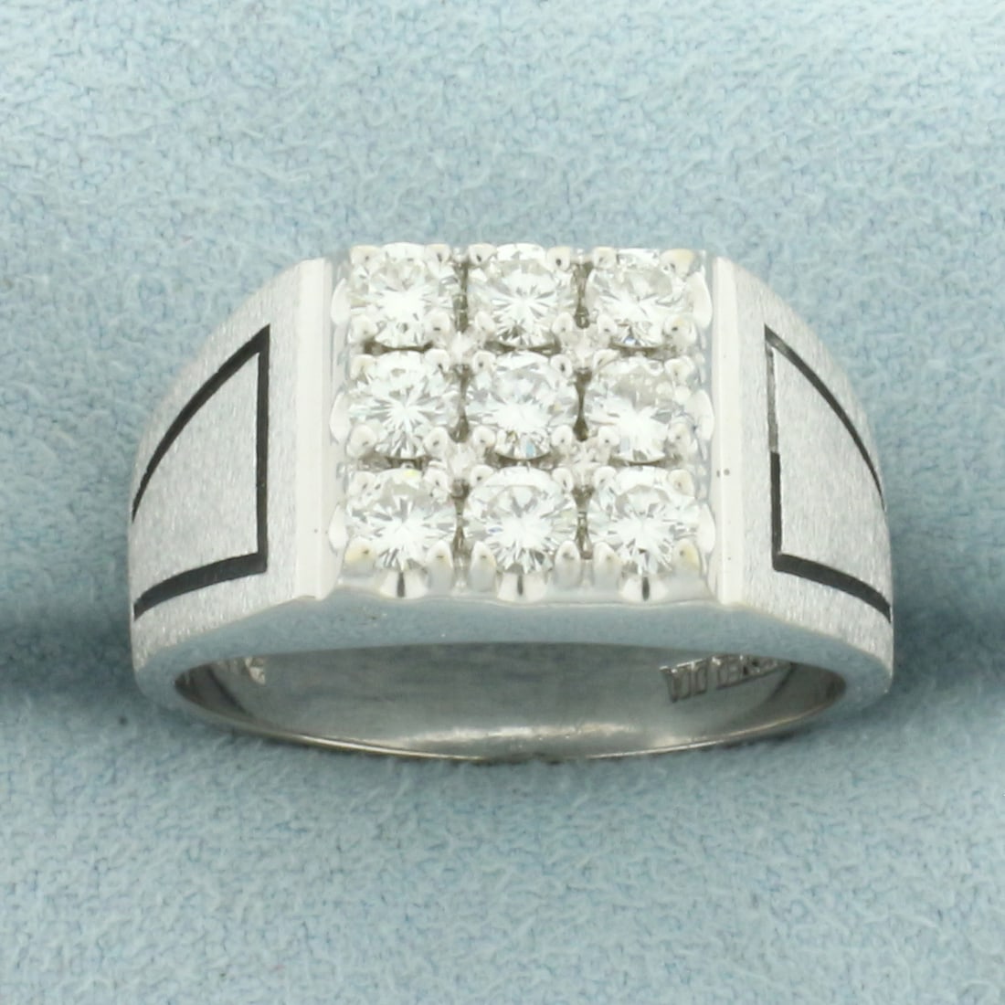 Mens Satin Finish Diamond Ring in 14k White Gold: In 14k white gold. Contains 9 high quality round brilliant cut diamonds, 1.35 ct TW,VS2 clarity/G color. Satin finish with black design on shoulders. 10.7mm wide at top of ring. Size: 9.5. 10.8g.