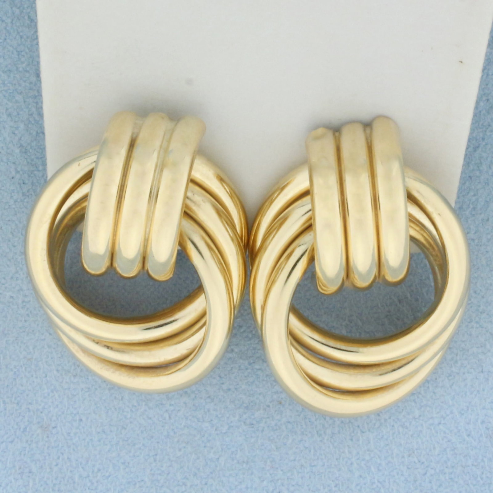 Designer Hoop Earrings in 14k Yellow Gold: In 14k Yellow Gold. 1 inch long. 7/8 inch wide. Omega backs. 10.5g.