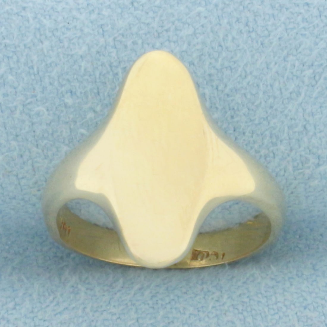 Engravable Oval Signet Ring in 10k Yellow Gold: In 10k Yellow Gold. Engravable face is 5/8 inch long. 3/8 inch wide. Size 4. 2.6g.