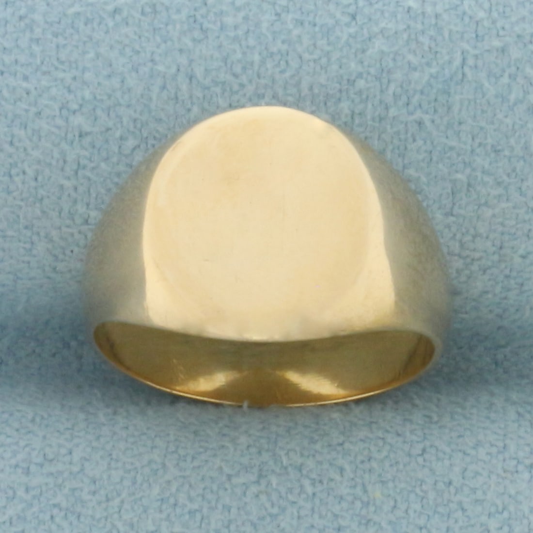 Oval Signet Ring in 18k Yellow Gold: In 18k Yellow Gold. 11.5mm tall (face of ring). Engravable. Size 4.75. 4.1g.