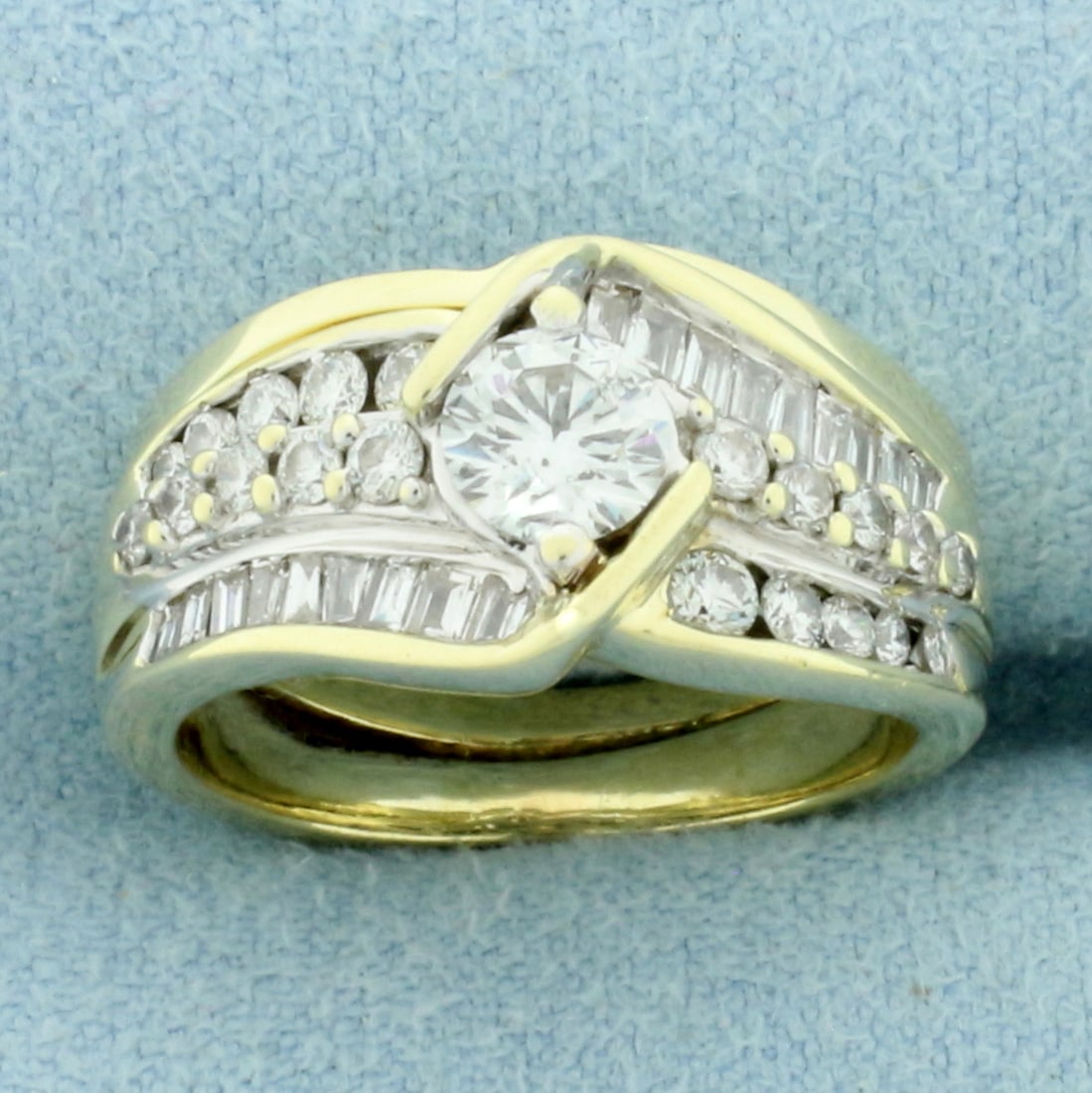 Vintage Round and Baguette Diamond Engagement Ring in 14k Yellow and White Gold: In 14k yellow and white gold. Center diamond is high quality .4ct round brilliant, H color/I1 clarity, eye clean, great cut for lots of sparkle. Also contains .6ct TW of round and baguette diamonds of
