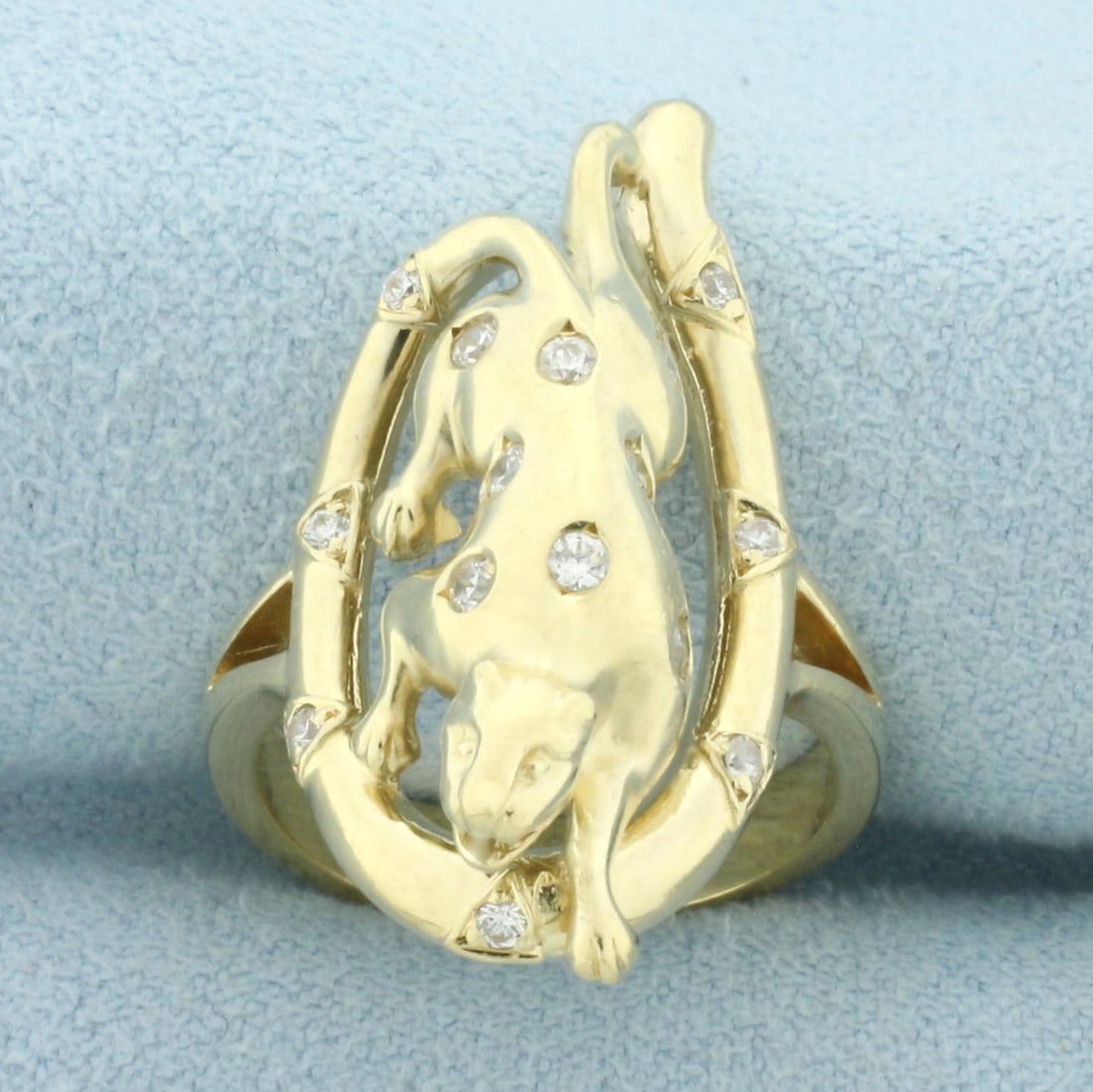 Custom Designed Cougar or Jaguar Ring in 14k Yellow Gold: In 14k yellow gold. Contains fifteen high quality .02ct white sapphire gemstones with excellent cut and clarity for added brilliance. 1 1/8" wide at center of ring. Size 6.5.