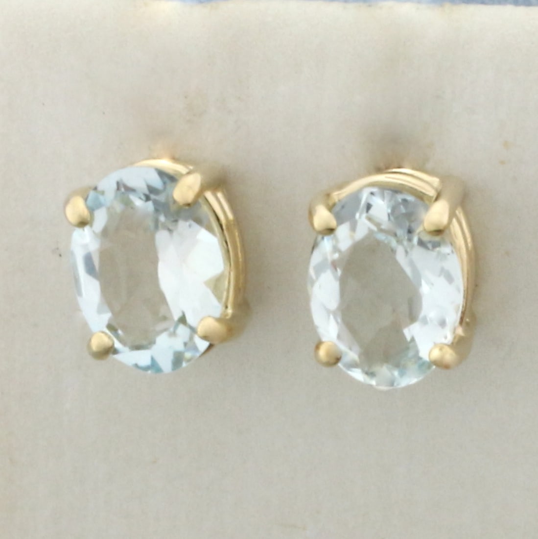 Aquamarine Stud Earrings in 14k Yellow Gold: In 14k Yellow Gold. Contains two 8x6mm high quality oval cut natural Aquamarine gemstones, approximately 2ct TW, with bright color and excellent clarity. Friction backs. 1.8g.