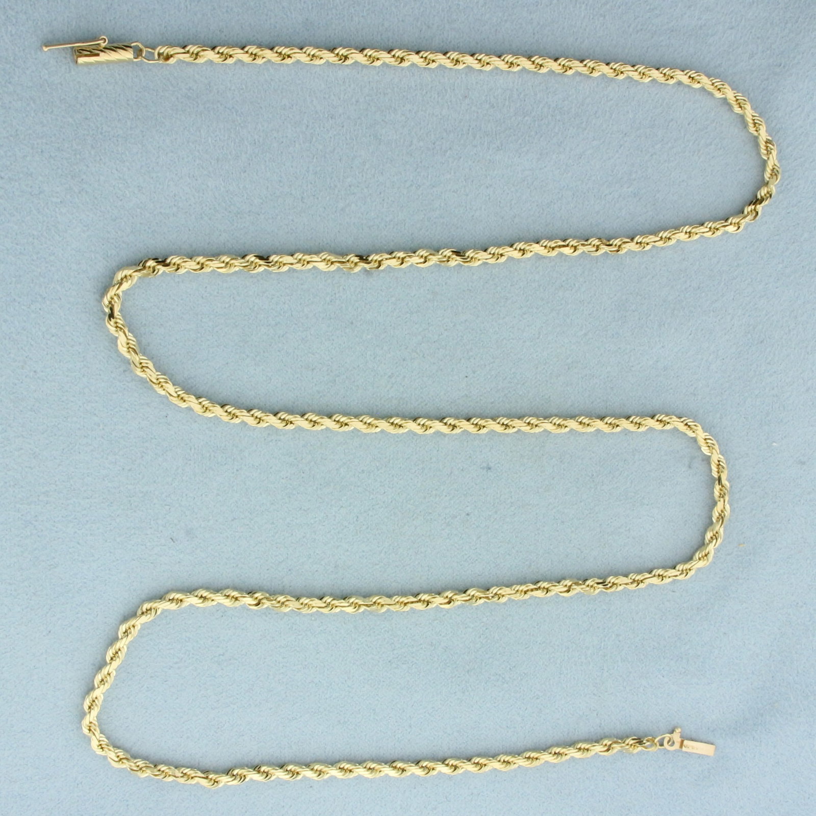24 Inch Rope Link Chain Necklace in 14k Yellow Gold: In 14k Yellow Gold. 244 inches long. 3.1mm wide. Barrel clasp with safety latch. 18.9g.