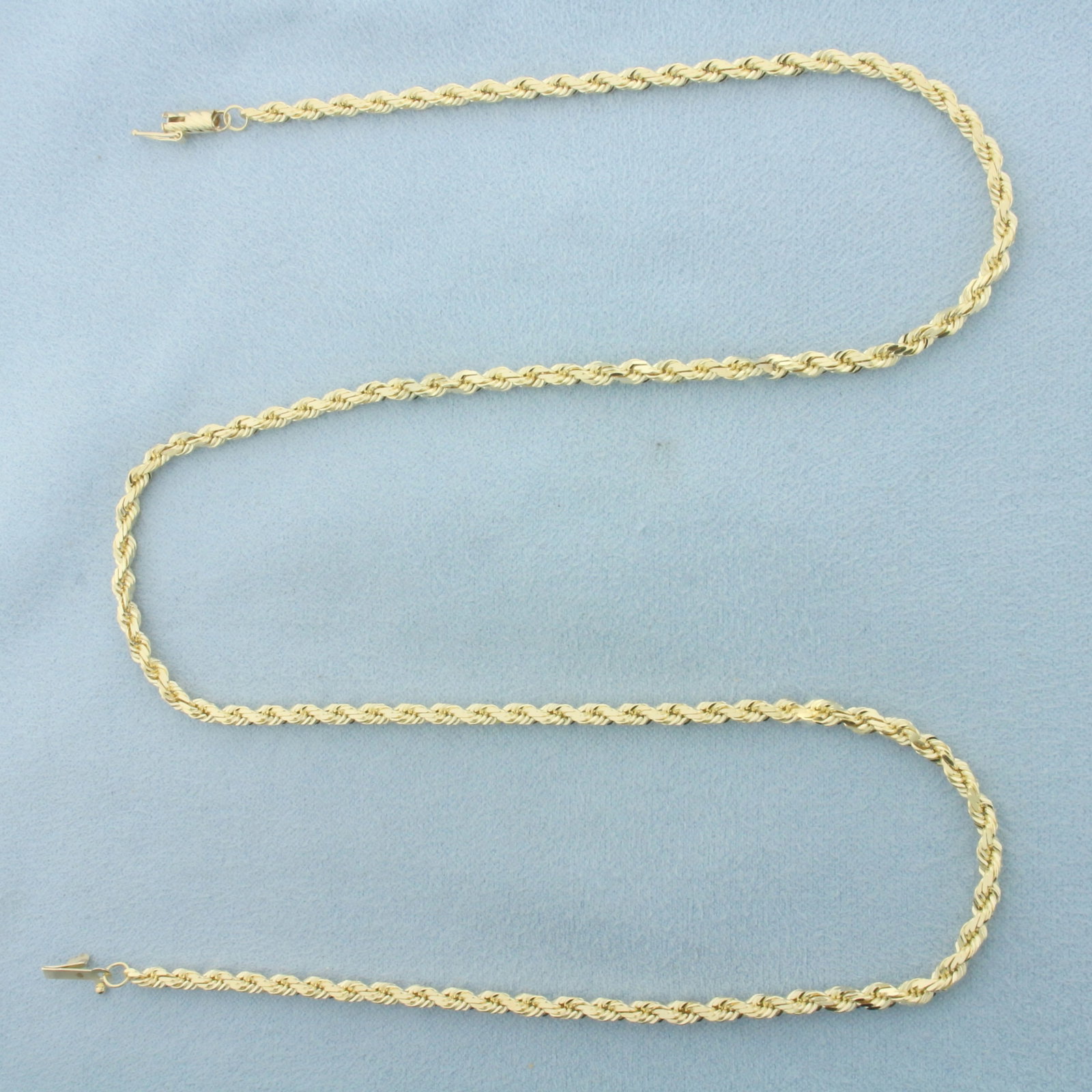 20 Inch Rope Link Chain Necklace in 14k Yellow Gold: In 14k Yellow Gold. 20 inches long. 2.7mm wide. Diamond cut for added brilliance. Barrel clasp with safety latch. 16.0g.