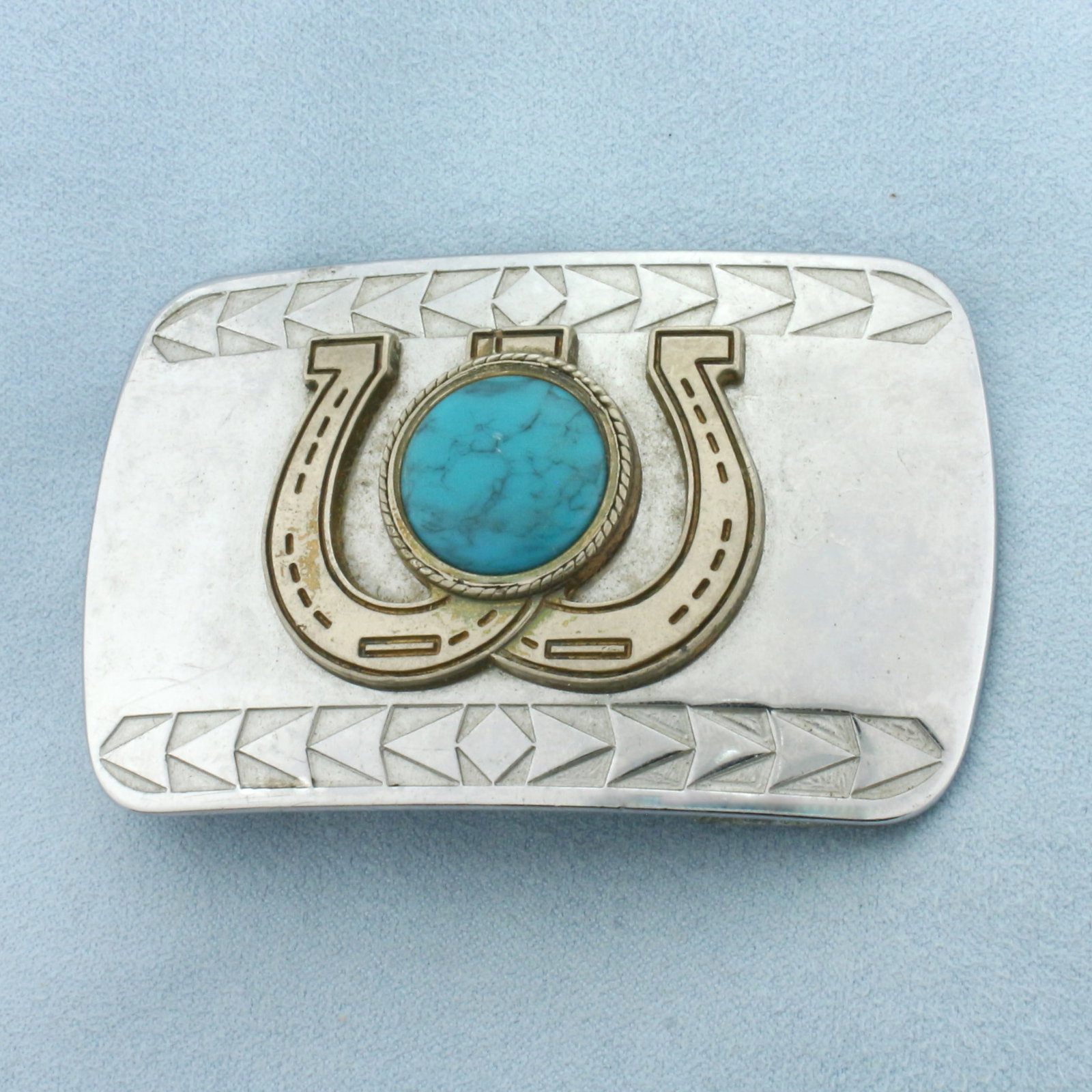 Turquoise Horseshoe Belt Buckle: 3 inches wide. 1 7/8 inch tall. 1 1/2 inch opening. 17mm high quality Turquoise gemstone. Plated silver.