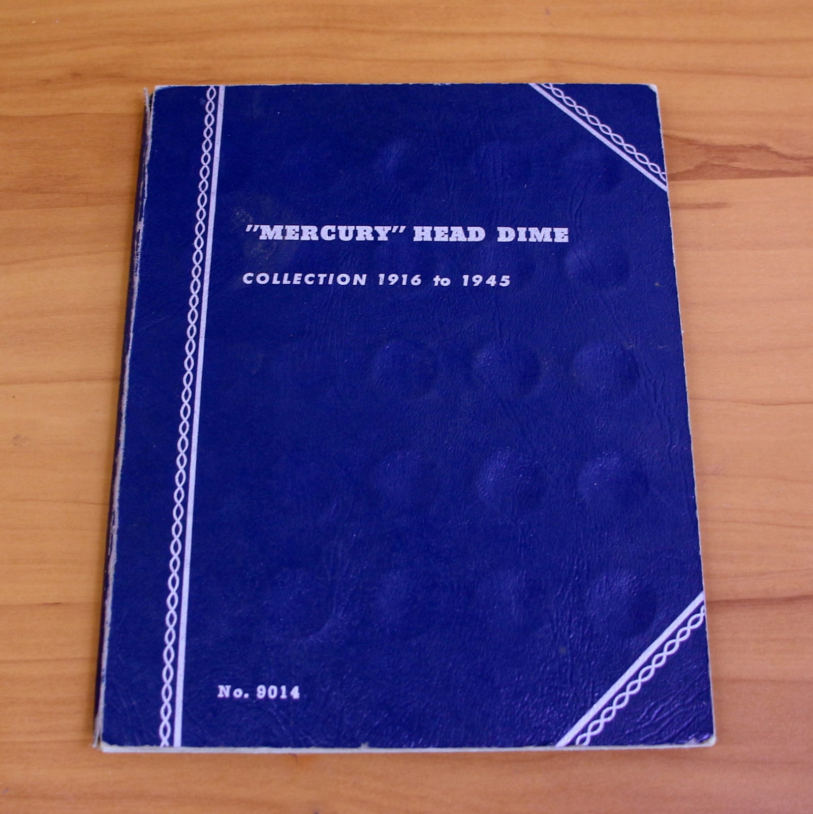 1916-1945 Silver Mercury Head Dime Coin Collection Blue Book: Contains one 1916-1945 Silver Mercury Head Dime Coin Collection. 67 dimes total. In blue book.