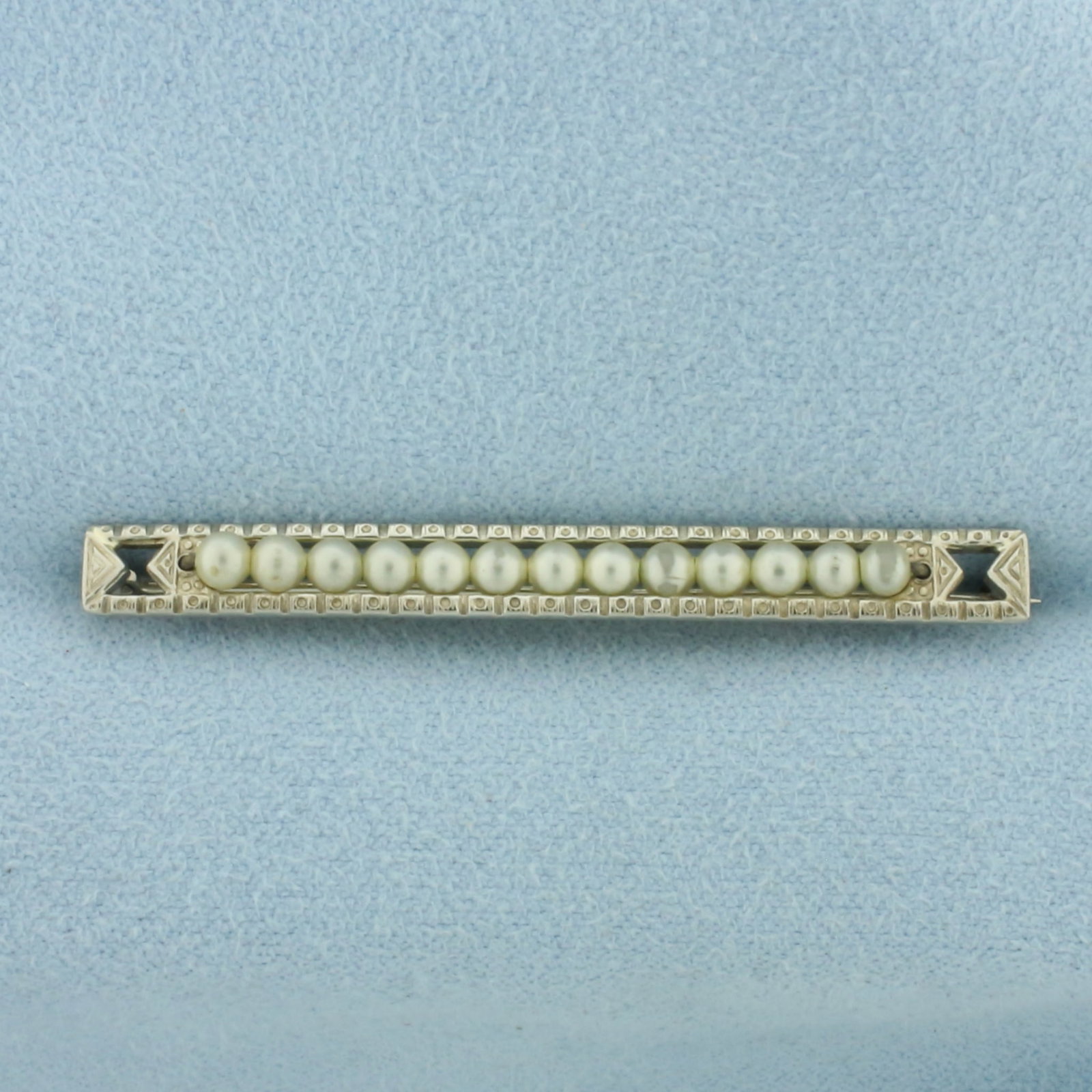Antique Seed Pearl Pin in 10k White Gold: In 10k White Gold. Contains thirteen high quality 2.5mm seed pearls with high luster. 1 7/8 inch by 1/8 inch wide. 2.6g.