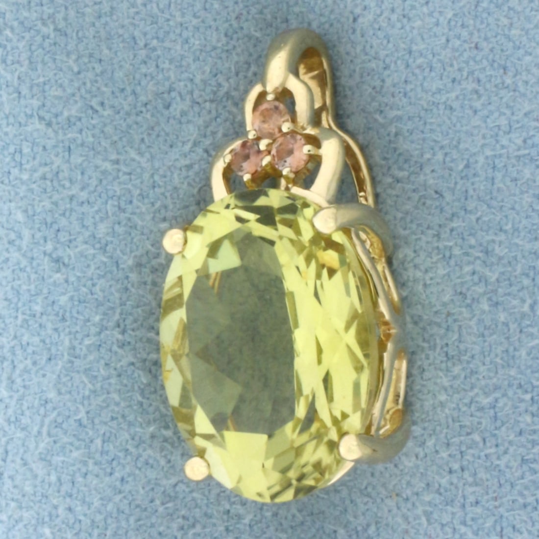 Citrine and Morganite Pendant in 14k Yellow Gold: In 14k Yellow Gold. Contains one 16x12mm high quality oval cut natural Citrine gemstone, approximately 8cts, with vibrant color and excellent clarity. Also contains three 2mm high quality natural Morg