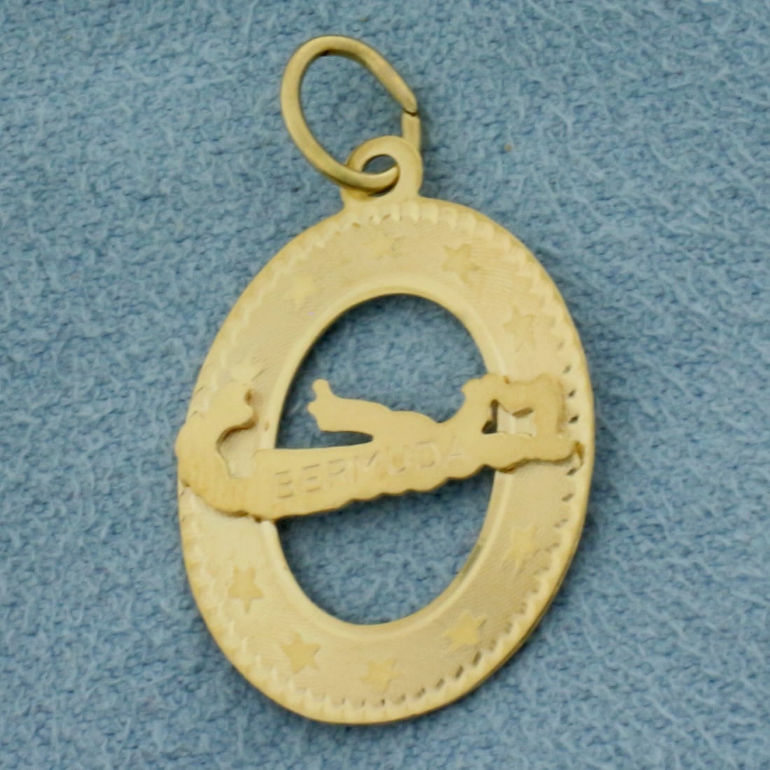 Bermuda Charm in 14k Yellow Gold: In 14k Yellow Gold. 7/8 inch long. 5/8 inch wide. 0.8g.