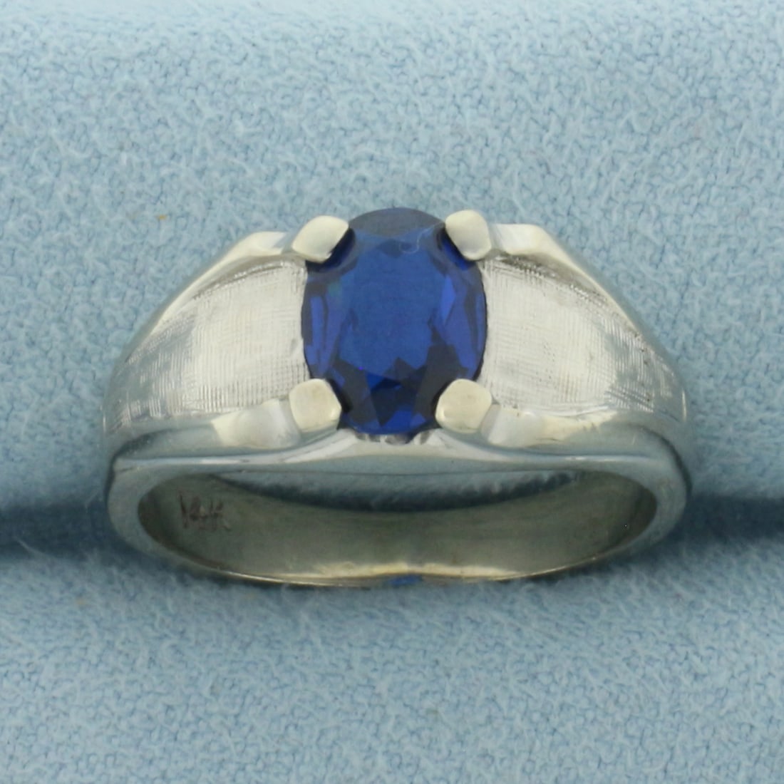 Sapphire Ring in 14k White Gold: In 14k White Gold. Contains one 8mm high quality oval cut Sapphire gemstone, approximately 1.5cts, with intense color and excellent clarity. Size 8.75. 6.0g.