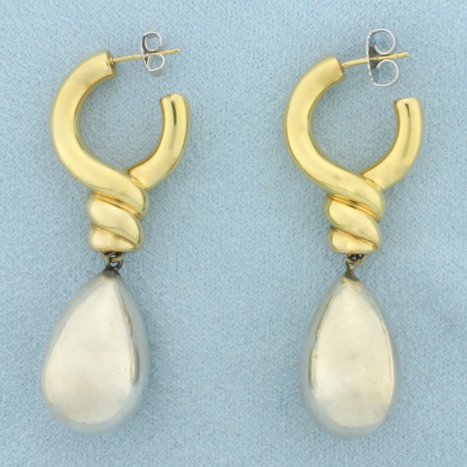 Teardrop Hoop Dangle Earrings in 18K Yellow Gold and Sterling Silver: In 18k yellow gold and .925 sterling silver. 1.875 inches long by 0.50 inches wide with 18k white gold friction backs. 6.9g.