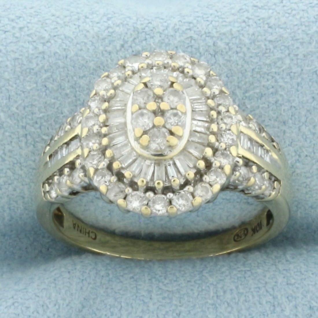 Diamond Target Halo Ring in 10k Yellow Gold: In 10k Yellow Gold. Contains forty round and thirty six baguette high quality diamonds, 2ct TW, I color/I clarity. 15.2mm wide at center top. Size 8. 4.1g.