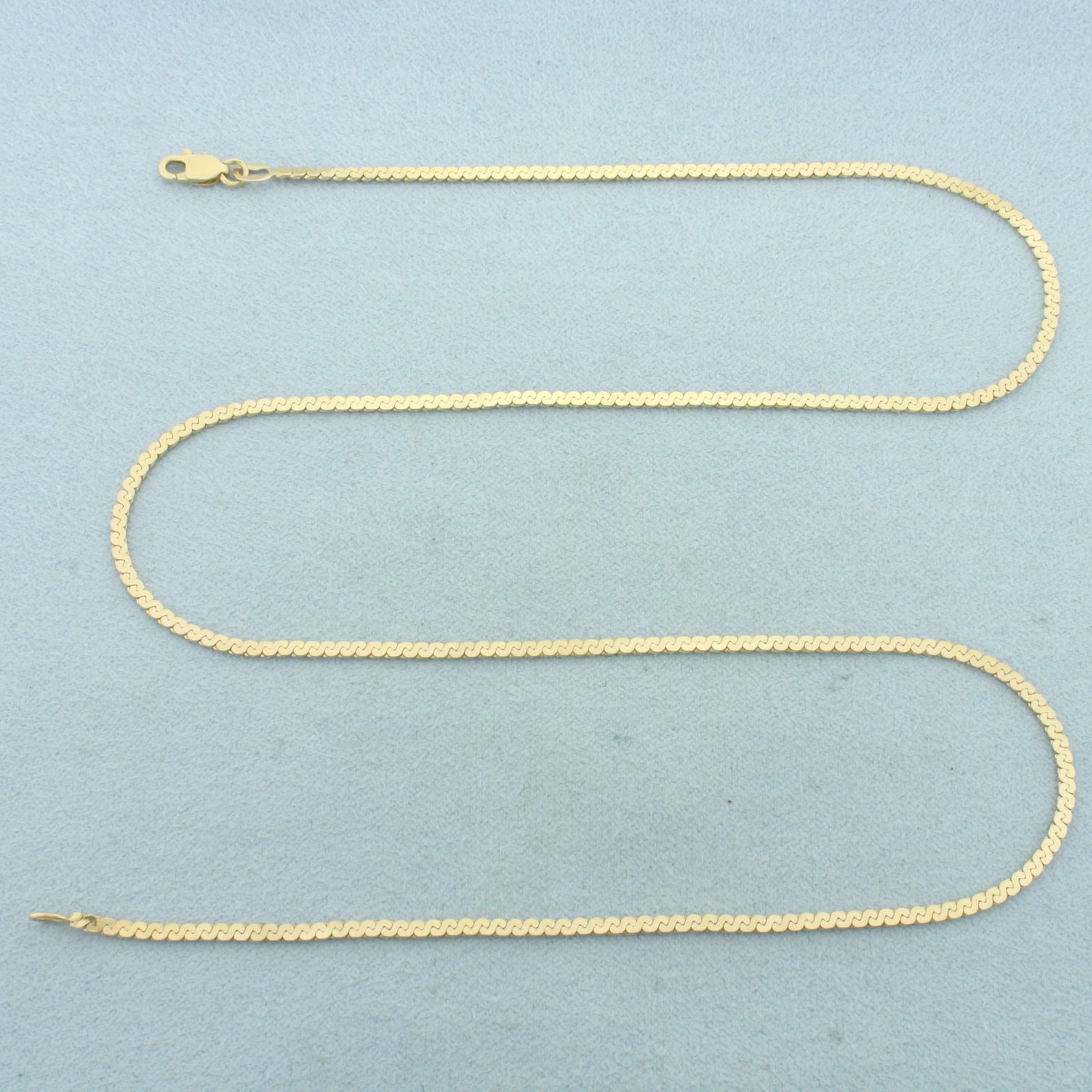 19 Inch S-Link Chain Necklace in 14k Yellow Gold: In 14k Yellow Gold. 19 inches long. 1.9mm wide. Lobster clasp. 6.2g.