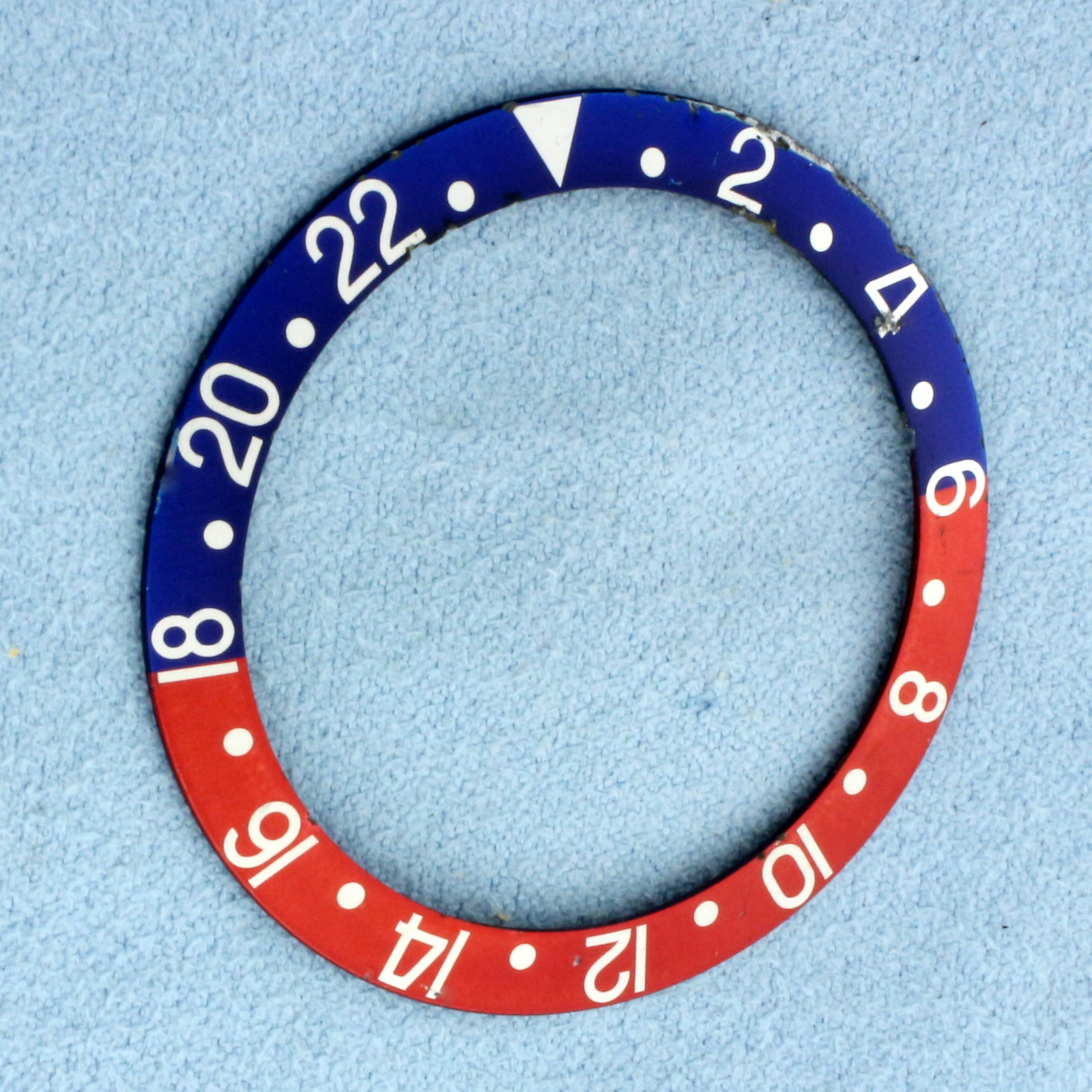 Original Genuine Rolex GMT-Master Pepsi Bezel: Rolex GMT-Master Pepsi Bezel Insert. Came from original watch. Minor scratches, pits, as shown on picture. 38mm outer diameter.