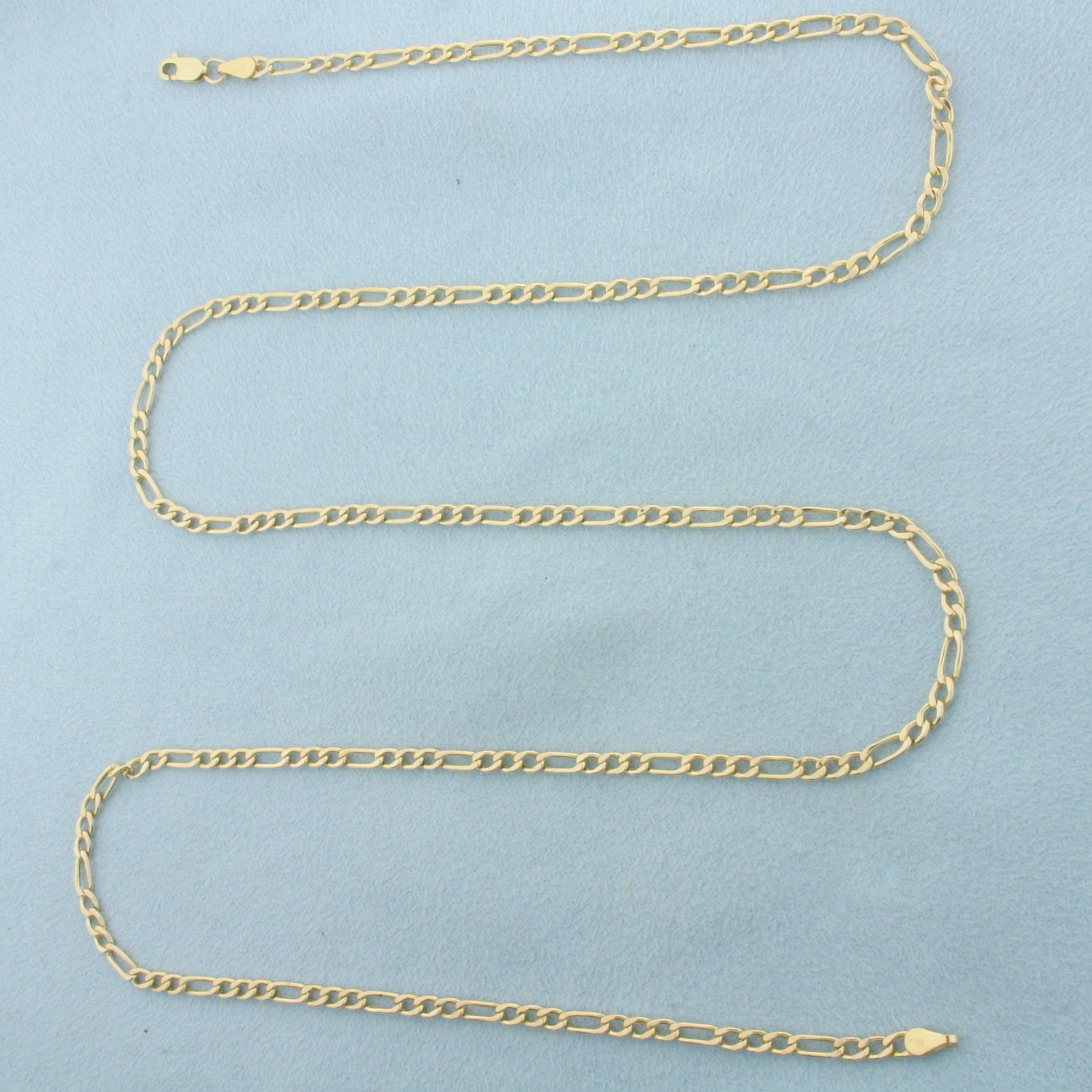 26 Inch Italian Figaro Chain Link Necklace in 10k Yellow Gold: In 10k Yellow Gold. 26 inches long. 3mm wide. Italian made. Lobster clasp. 3.5g.