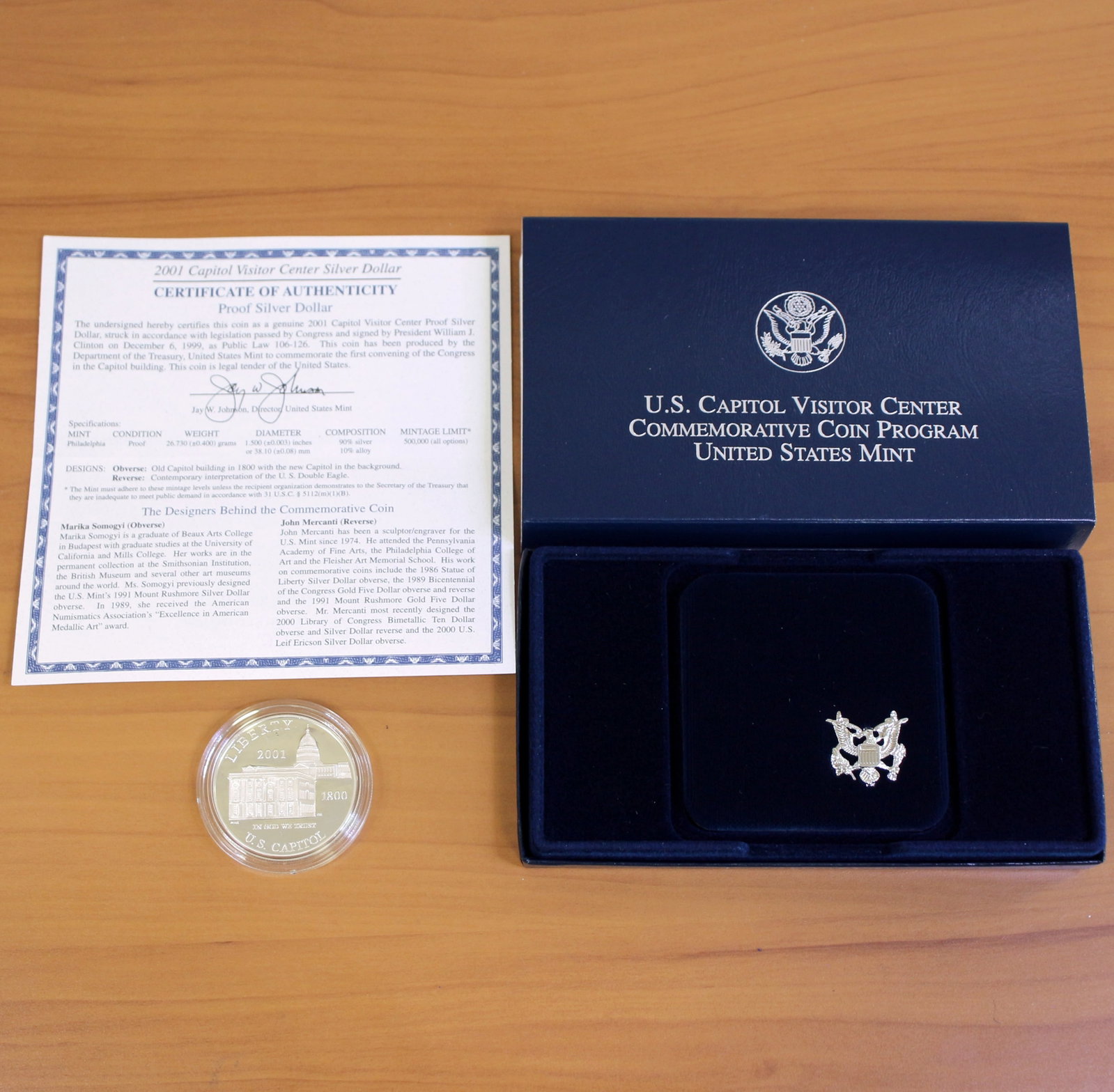 US Mint Capitol Visitor Center Silver Dollar Proof Coin OGP: Contains one 2001 United States Mint 90% Silver Commemorative Silver Dollar. Set in original packaging and contains certificate of authenticity.