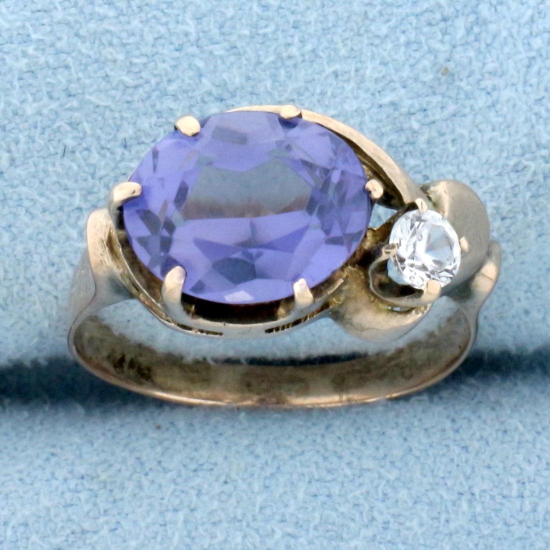 Antique Purple and White Sapphire Ring in 14K Rose Gold: In 14K Rose Gold. Contains one high quality natural 10 x 8mm oval shaped Purple Sapphire gemstone with a slight color shift from blue to violet purple depending on the light source. Also contains one 