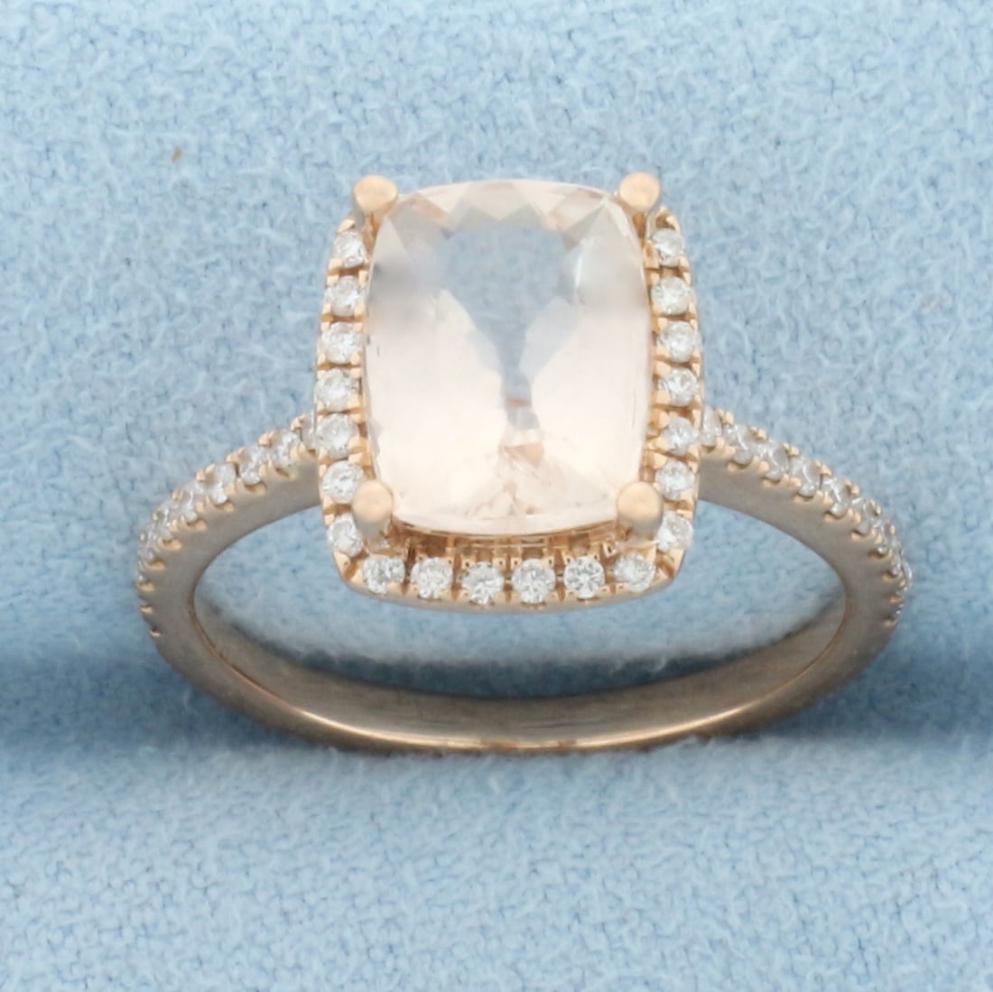 Morganite and Diamond Halo Ring in 14k Rose Gold: In 14k rose gold. Contains one high quality natural 9mm by 7mm rectangular cushion cut Morganite gemstone, approximately 2.5cts, with vibrant pink salmon color and excellent clarity. Also contains for