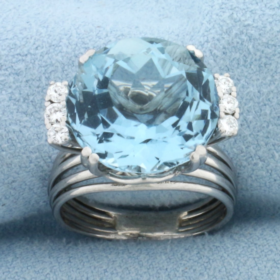 8ct Aquamarine and Diamond Ring in 18k White Gold: In 18k White Gold. Contains one 14mm AAA quality natural aquamarine gemstone, approximately 8cts, with intense color and excellent clarity. Also contains six .03ct high quality diamonds, VS clarity/G 