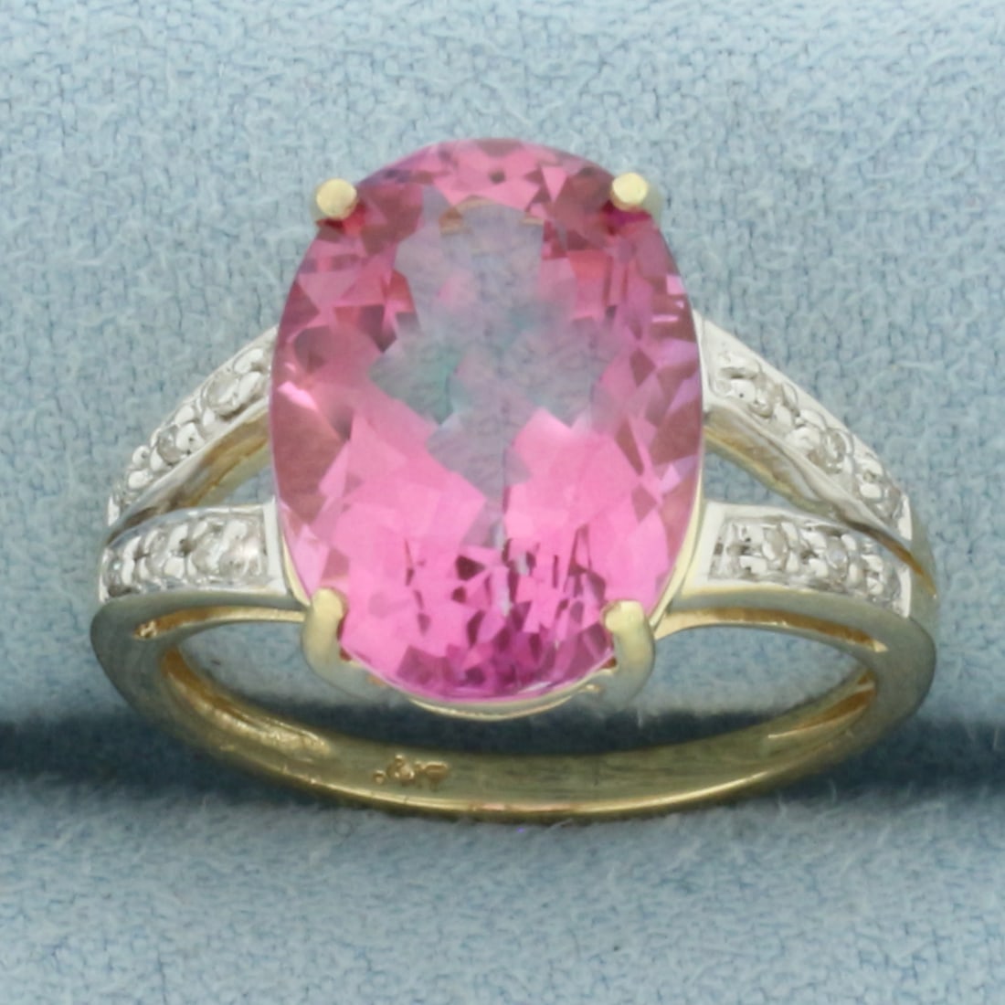6ct Lab Pink Sapphire and Diamond Ring in 10k Yellow Gold: In 10k Yellow Gold. Contains one 14x10mm high quality natural Pink Sapphire gemstones, approximately 6ct, with intense color and excellent clarity. Also contains twelve high quality 1/2pt diamonds. Si