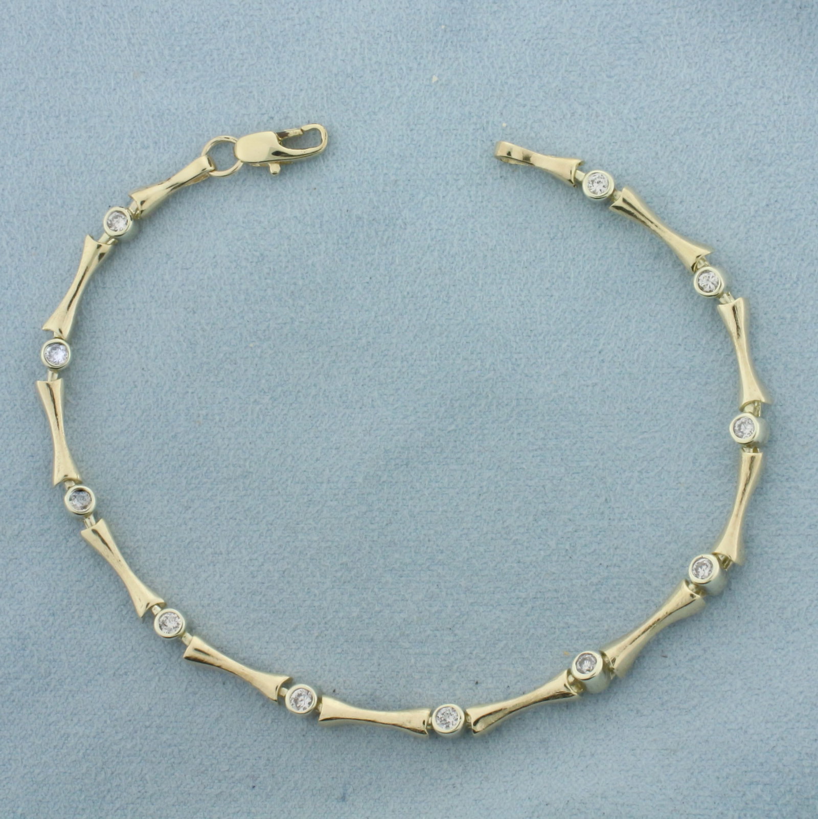 Diamond Tennis Bracelet in 10K Yellow and White Gold: In 10k yellow and white gold. 8 1/8 Inches long, 3.5mm wide. Contains eleven high quality natural diamonds, 1ct TW, SI clarity/H color. Lobster clasp. 8.8g.