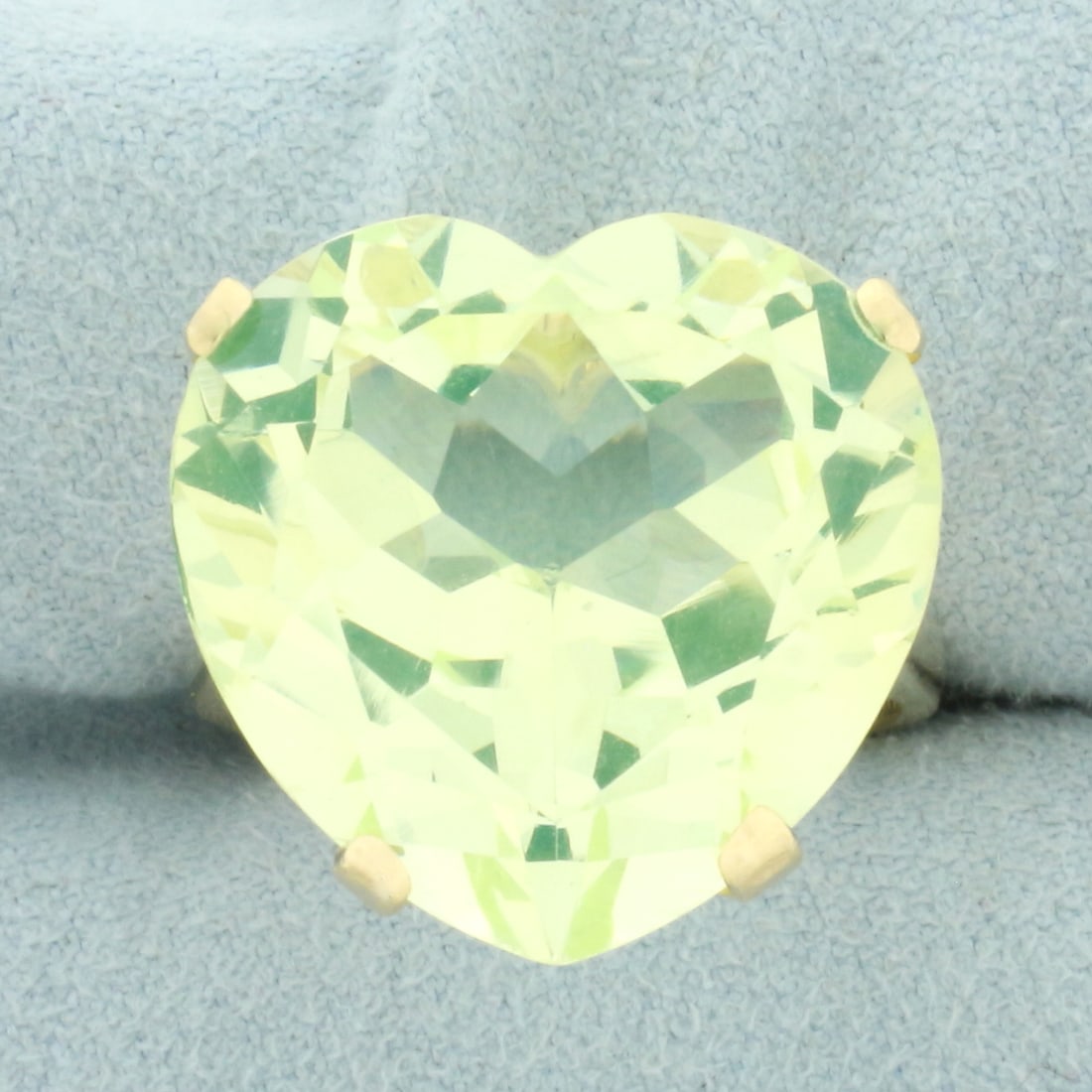 Large Ceylon Green Spinel Heart Ring in 14k Yellow Gold: In 14k yellow gold. Contains one high quality heart cut very large 20mm heart cut tourmaline gemstone with vibrant neon green color and excellent clarity, approximately 22cts. Size: 8.75. 10.6g.